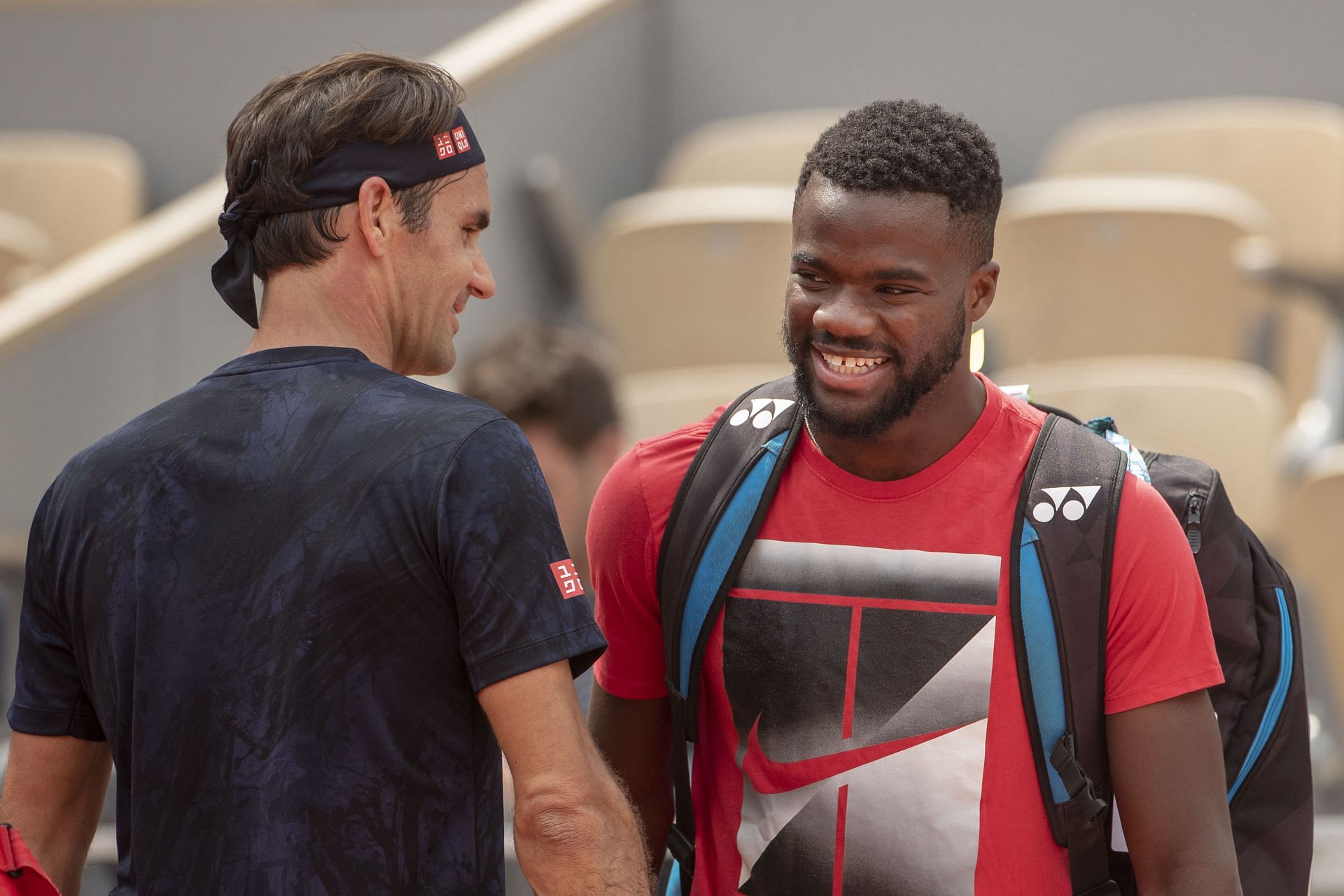 Roger Federer (L) and Frances Tiafoe (R) (Image via Getty)