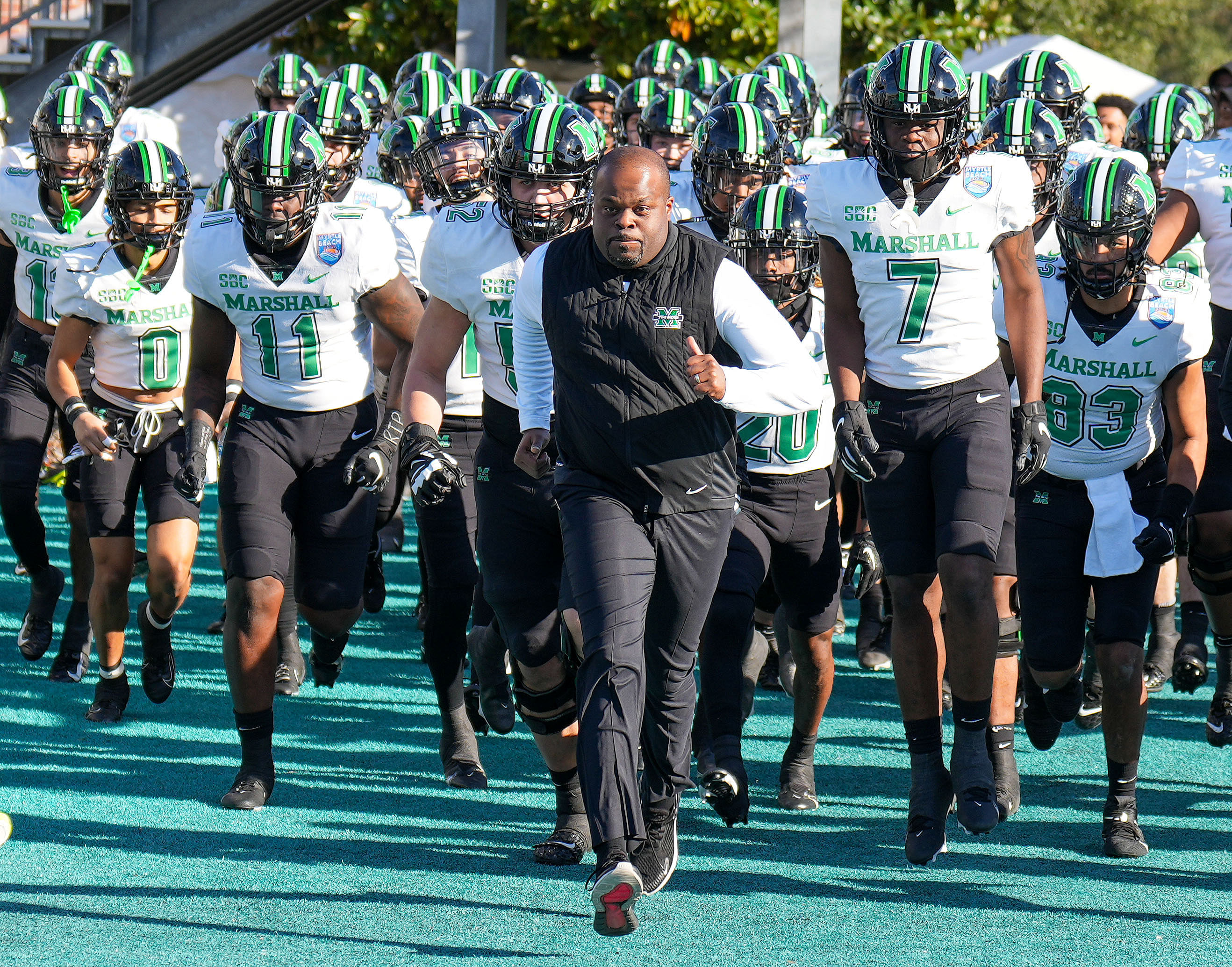 Marshall Thundering Herd head coach Charles Huff leads his team onto the field - Source: Imagn