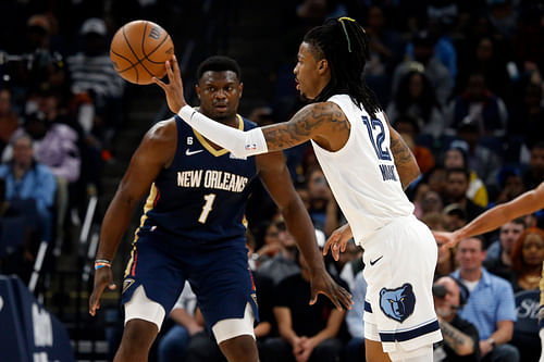 Memphis Grizzlies guard Ja Morant passes the ball against New Orleans Pelicans forward Zion Williamson during the first quarter at FedExForum (Photo Credits: IMAGN)