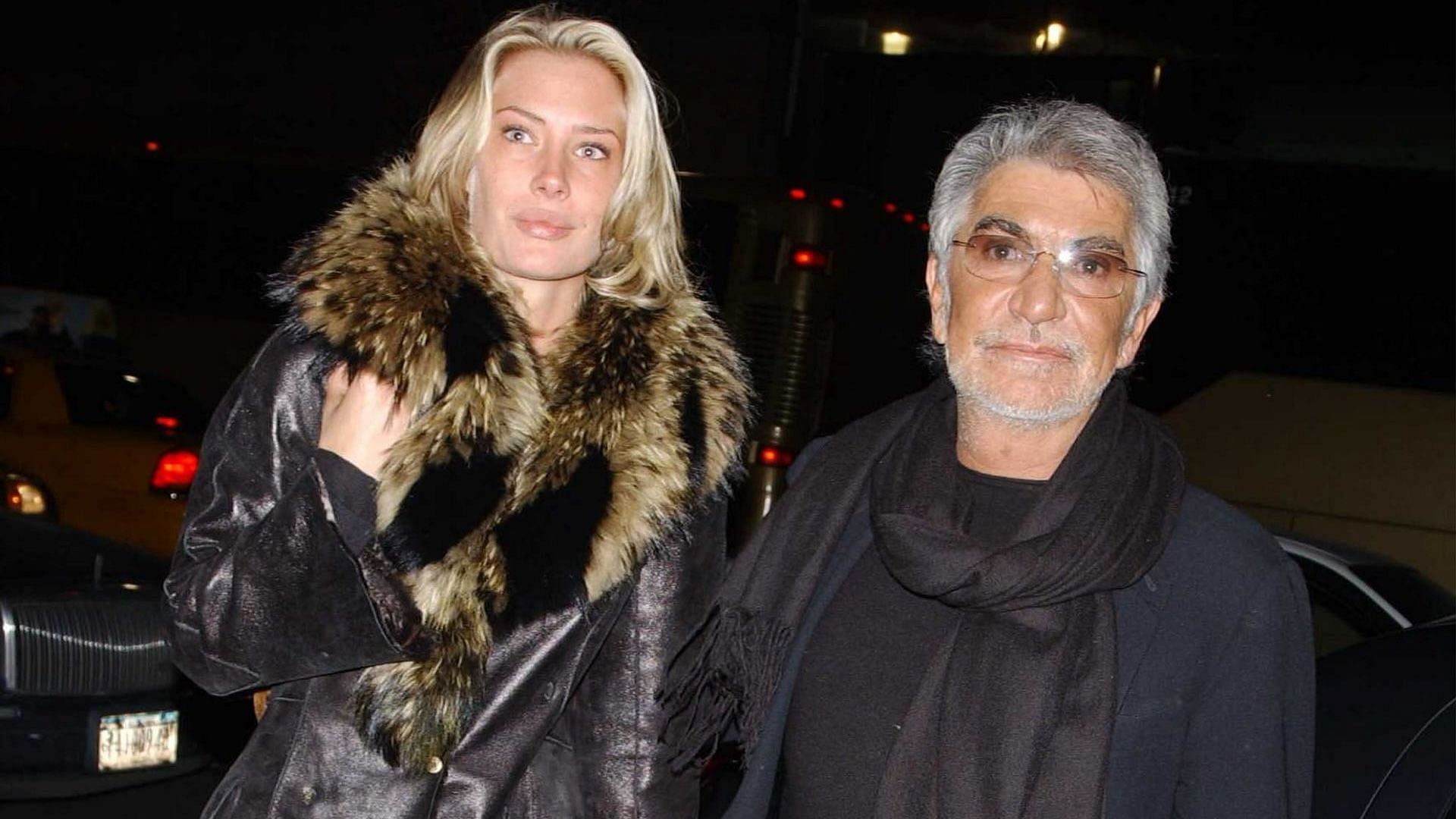 (L-R) Model and actress Crystal McKinney and designer Roberto Cavalli arrive at the Sean John Fall/Winter 2003 Men&#039;s Collection fashion show at Cipriani 42nd Street during Mercedes-Benz Fashion Week February 8, 2003 in New York City, New York. (Photo by Arnaldo Magnani/Getty Images)