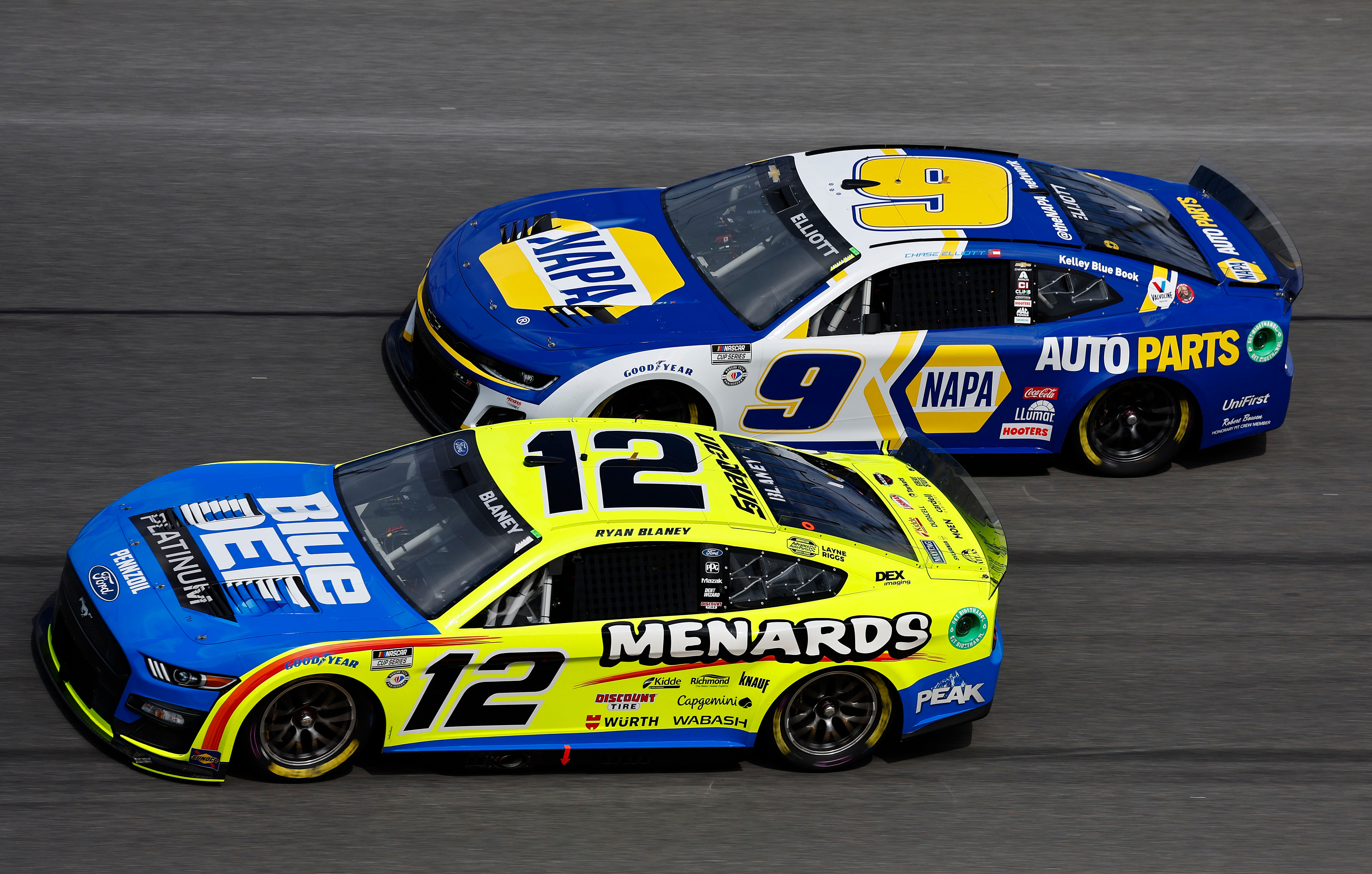 Ryan Blaney (12) and driver Chase Elliott (9) drive side by side during the Daytona 500 at Daytona International Speedway. Mandatory Credit: Mike Dinovo-Imagn Images