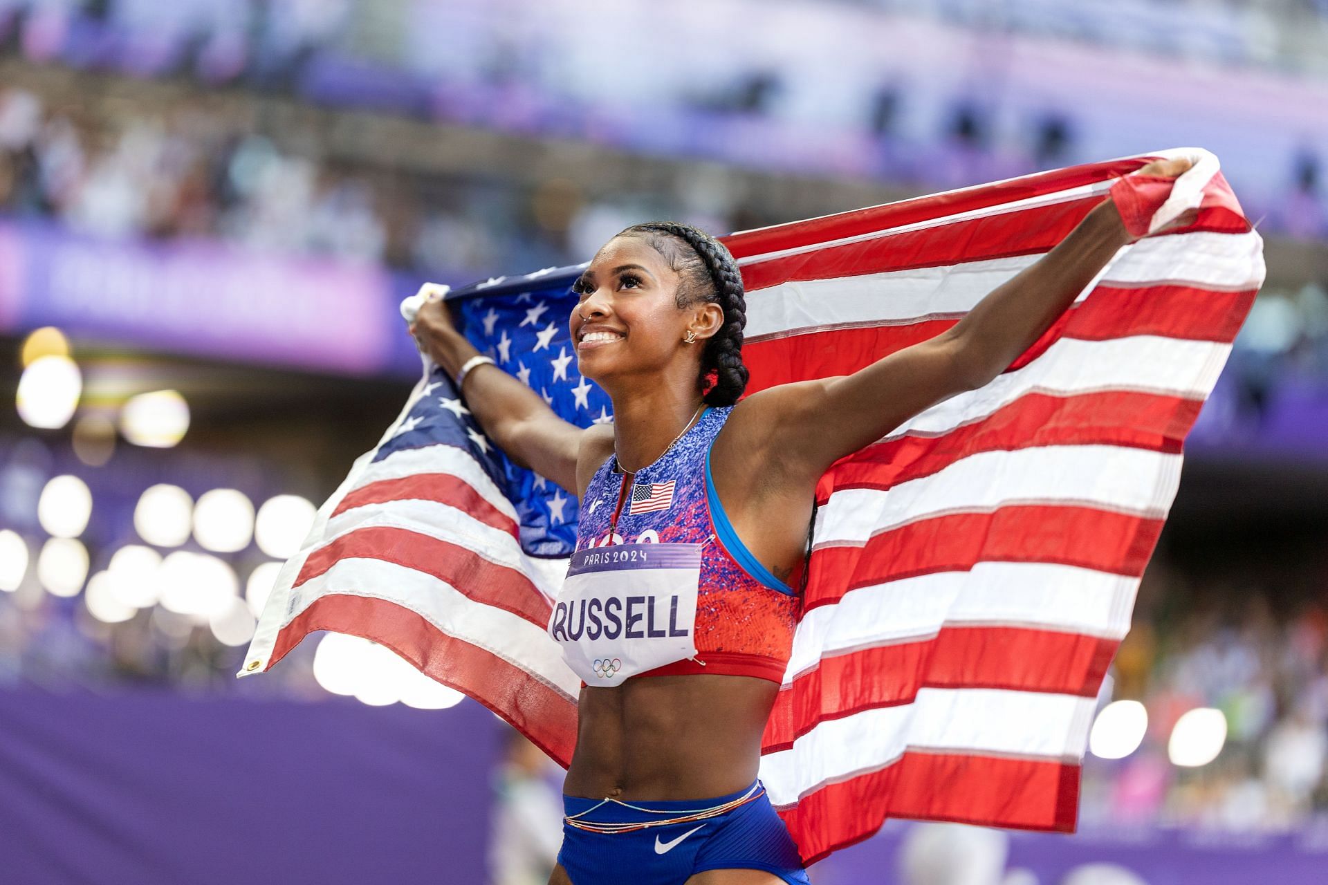 Masai Russell of the USA celebrates after winning the 100m hurdles event at the Paris Olympics 2024 [Image Source: Getty]