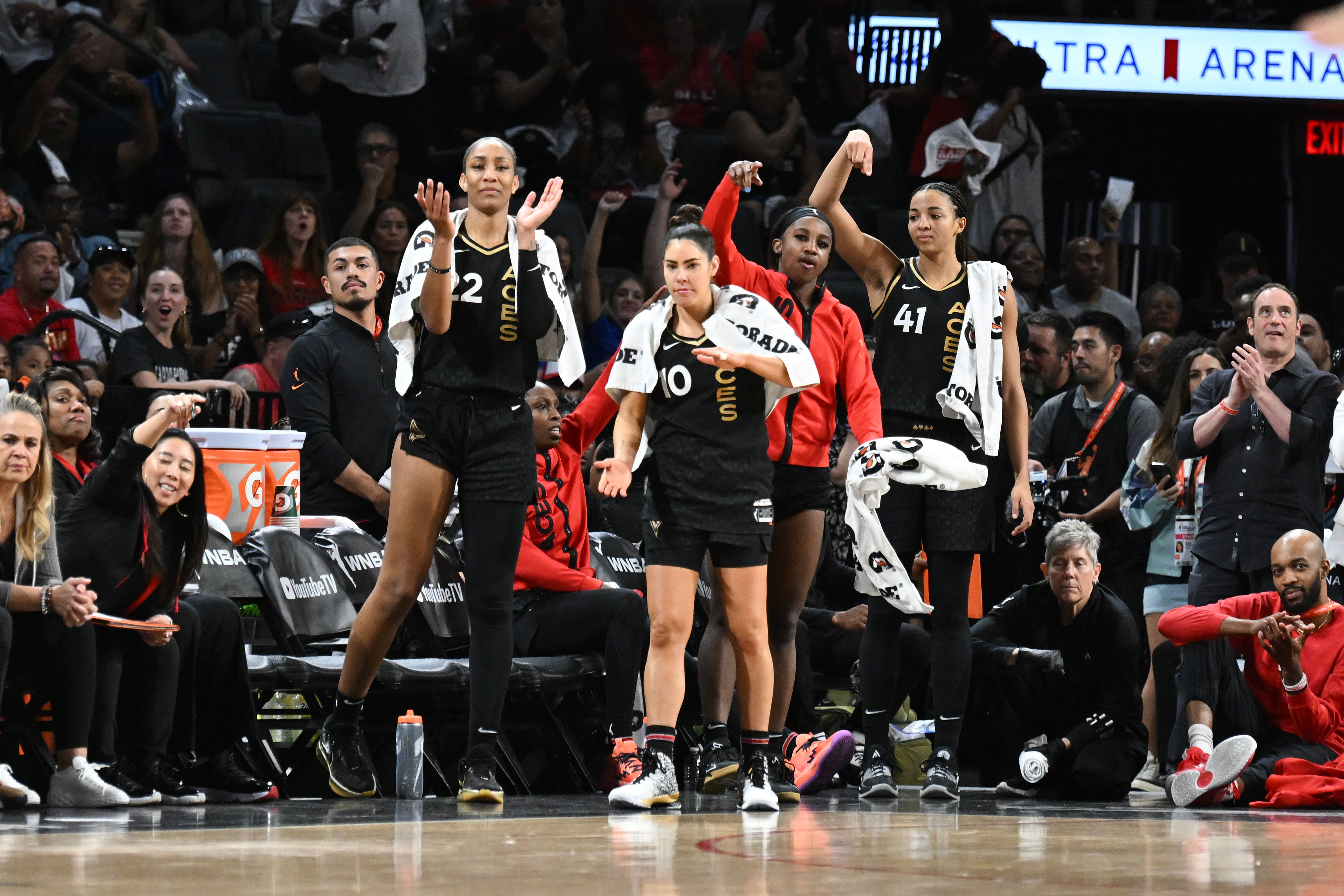 Las Vegas Aces forward A&#039;ja Wilson, guard Kelsey Plum, guard Jackie Young and center Kiah Stokes react to a play against the New York Liberty. Photo Credit: Imagn