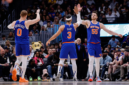 New York Knicks center Isaiah Hartenstein reacts with guard Josh Hart and guard Donte DiVincenzo against the Denver Nuggets at Ball Arena. Photo Credit: Imagn