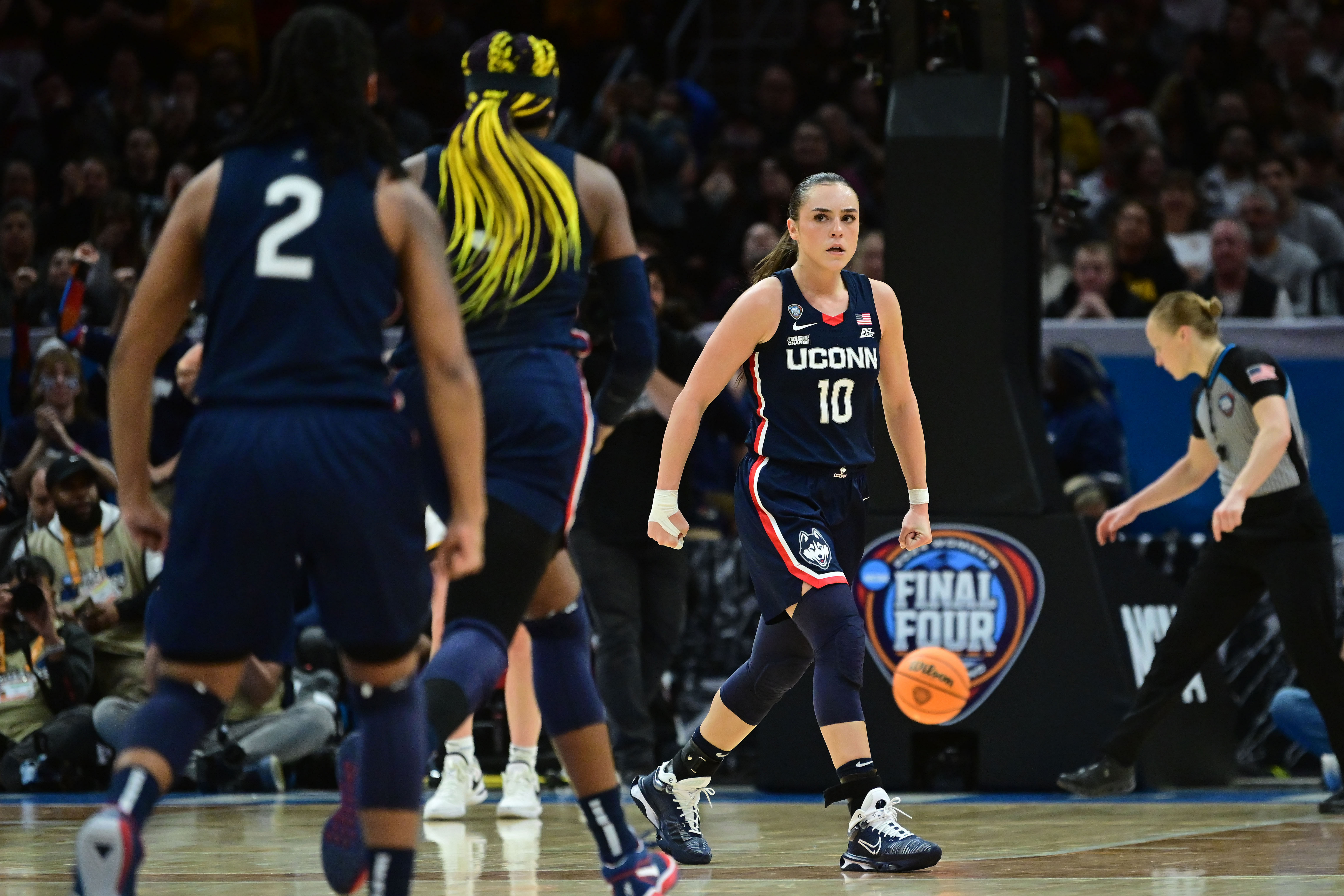 Connecticut Huskies guard Nika Muhl reacts after a basket against the Iowa Hawkeyes in the 2024 NCAA Tournament. Photo Credit: Imagn