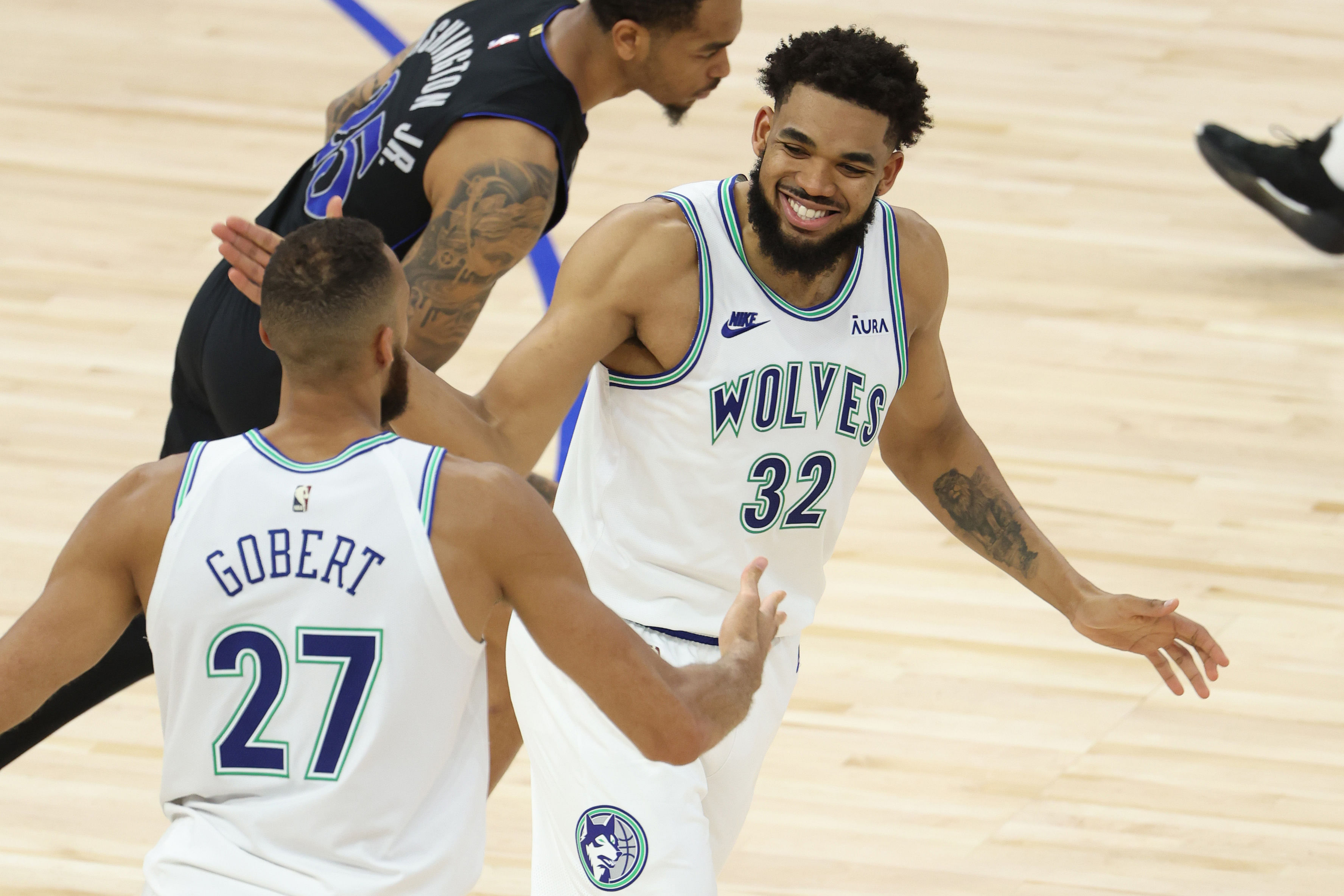 Karl-Anthony Towns and Rudy Gobert react against the Dallas Mavericks during the 2024 NBA playoffs at Target Center. Photo Credit: Imagn