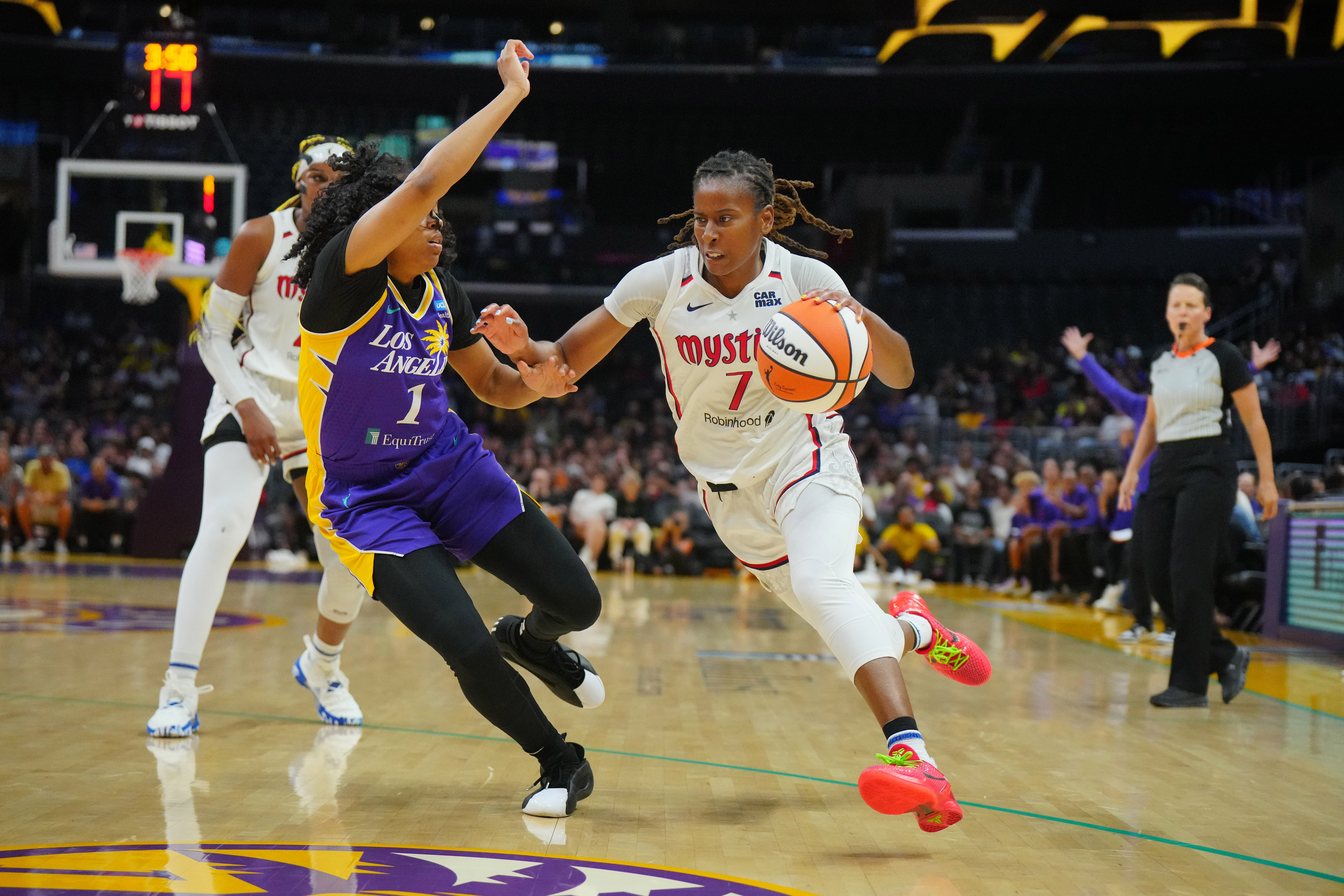 Washington Mystics guard Ariel Atkins dribbles the ball against LA Sparks guard Zia Cooke at Crypto.com Arena. Photo Credit: Imagn