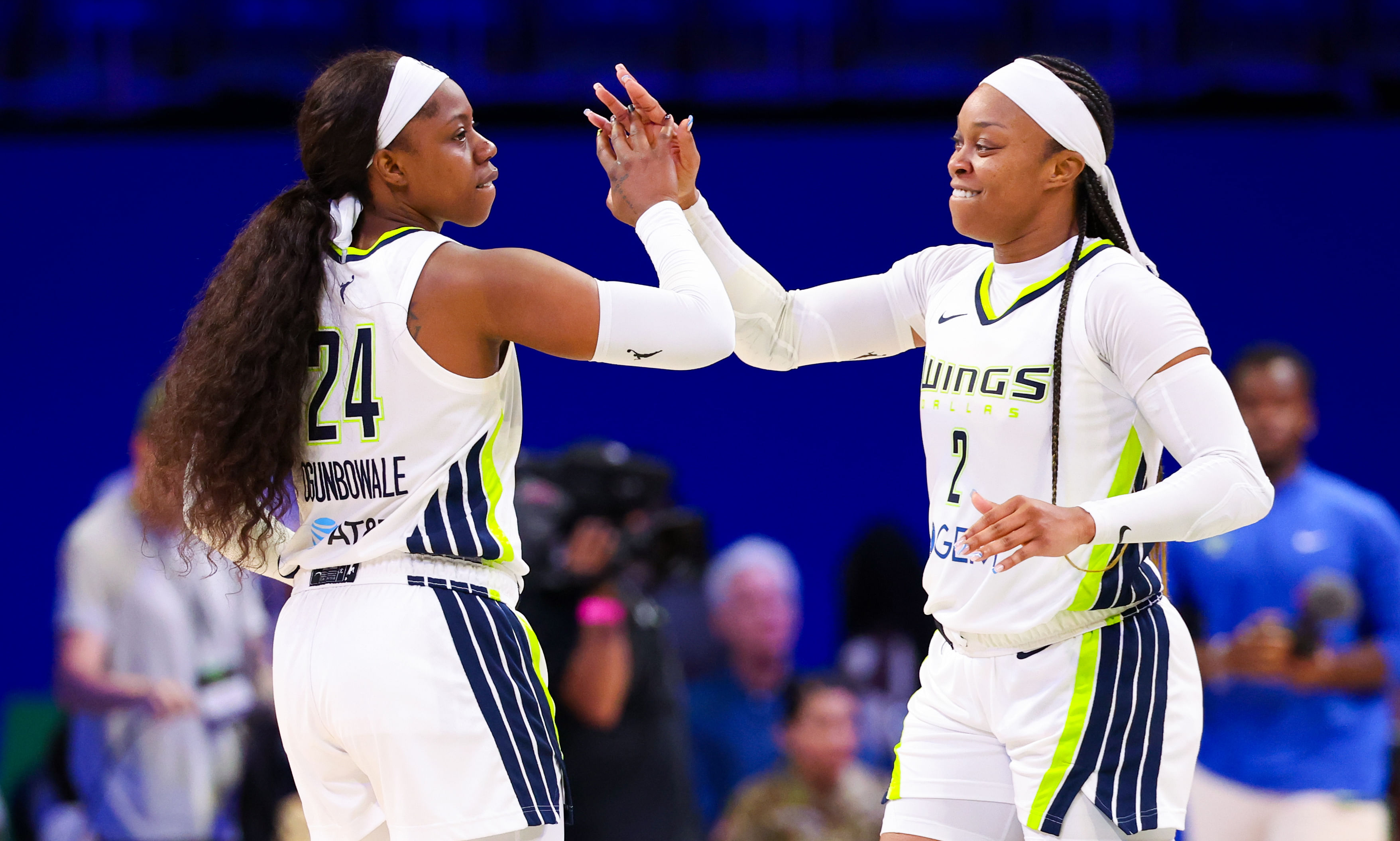 Dallas Wings guard Arike Ogunbowale celebrates with Dallas Wings guard Odyssey Sims after the game against the Indiana Fever. Photo Credit: Imagn