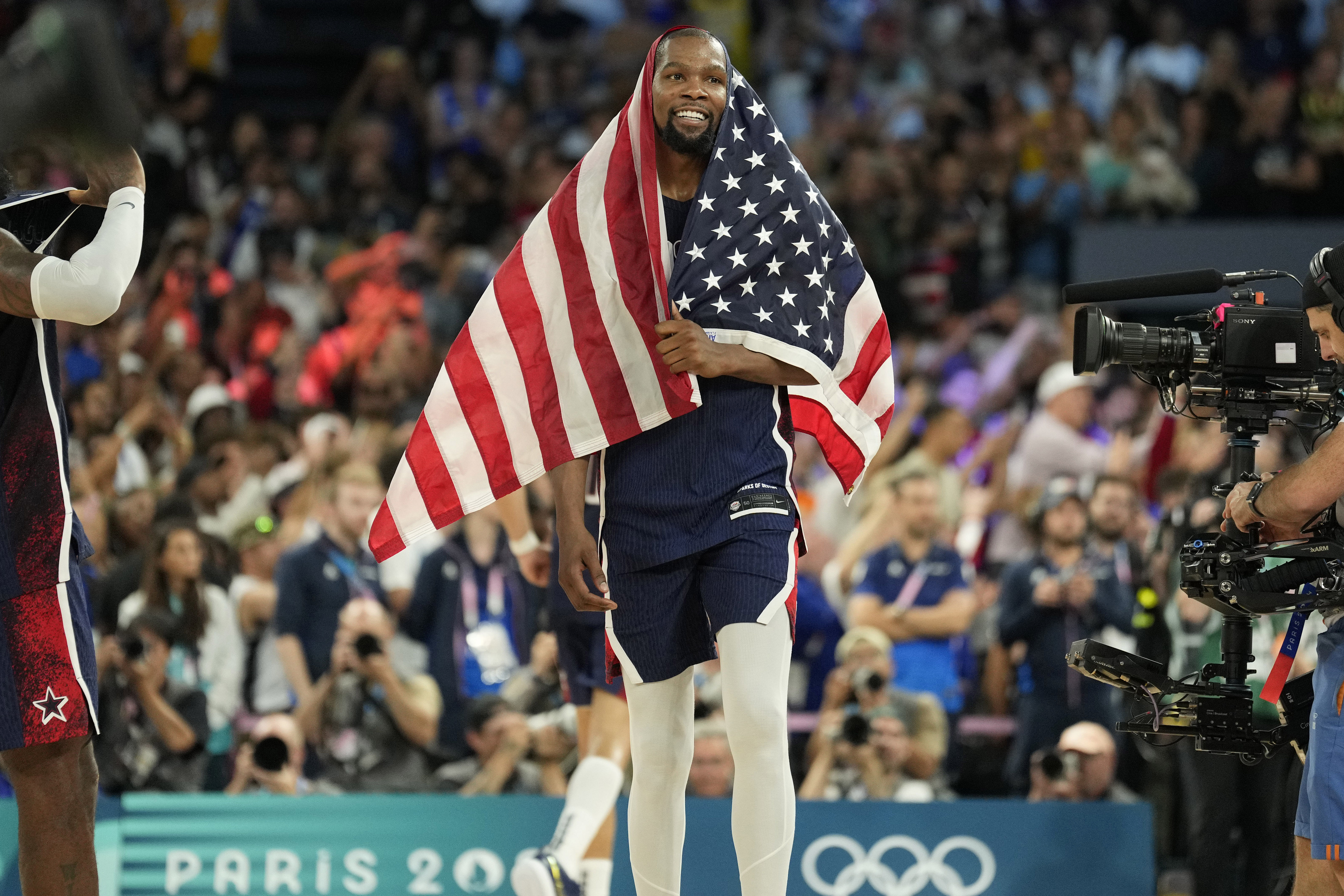 Kevin Durant celebrates after defeating France in the men&#039;s basketball gold medal game at the Paris 2024 Olympics. Photo Credit: Imagn