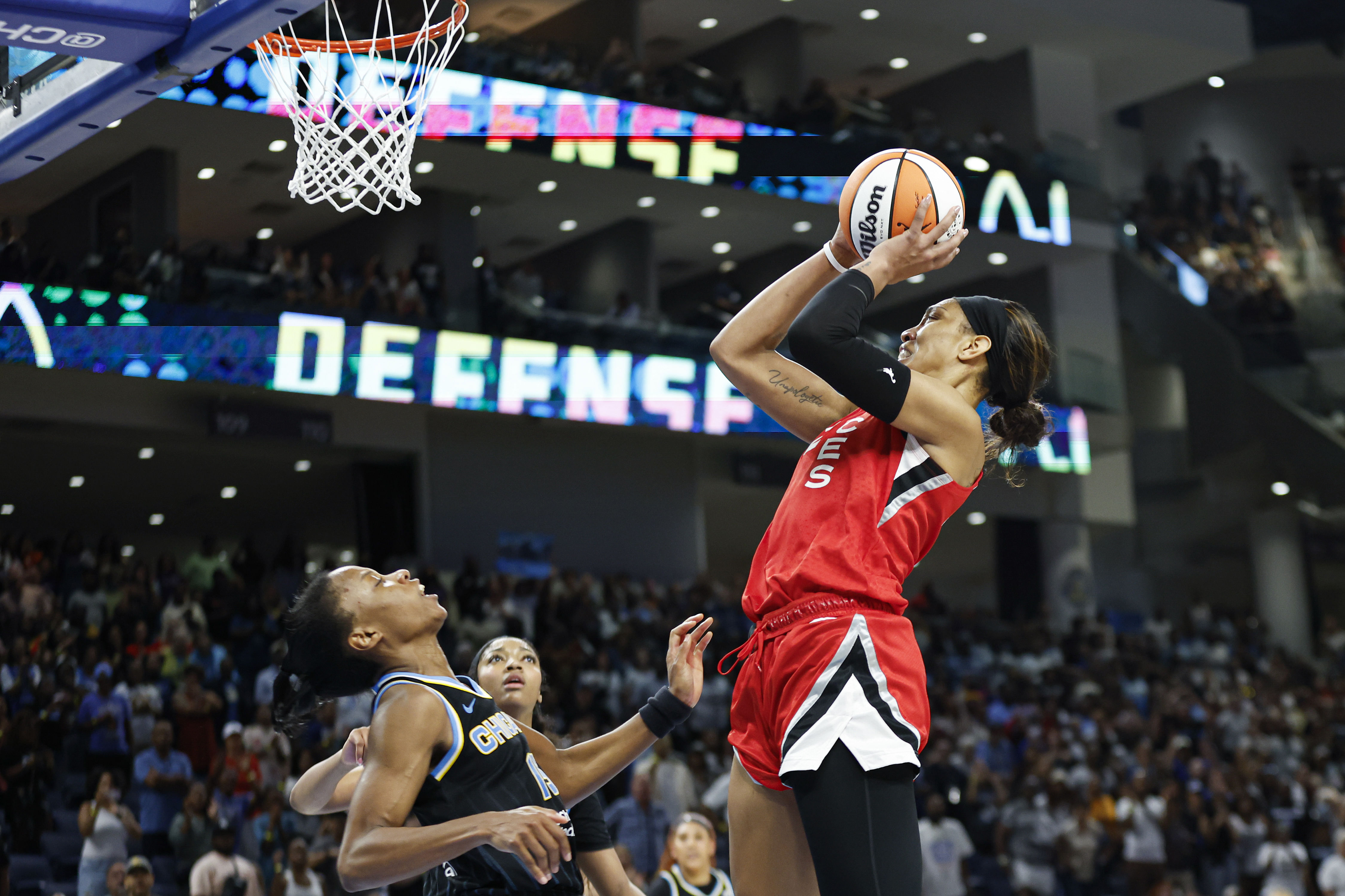 Las Vegas Aces center A&#039;ja Wilson shoots and scores game winning basket against the Chicago Sky at Wintrust Arena. Photo Credit: Imagn