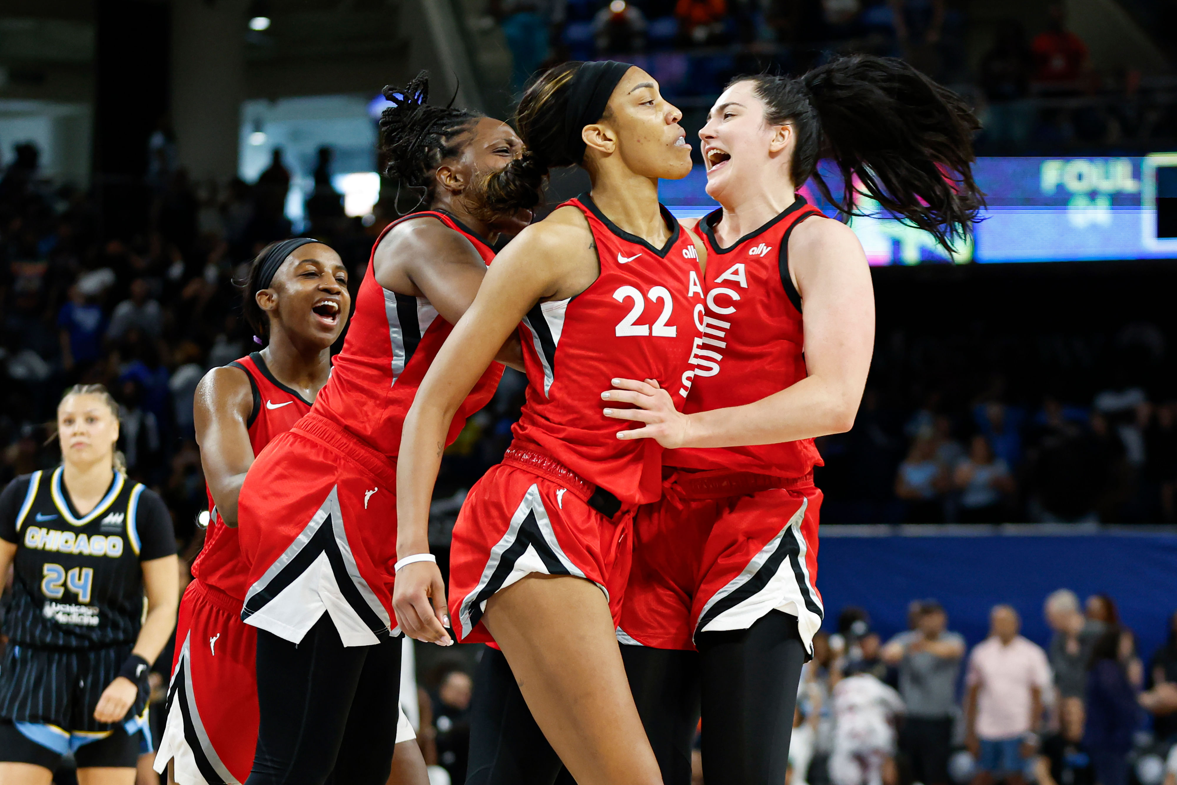 Las Vegas Aces center A&#039;ja Wilson celebrates with teammates after scoring game winning basket against the Chicago Sky at Wintrust Arena. Photo Credit: Imagn