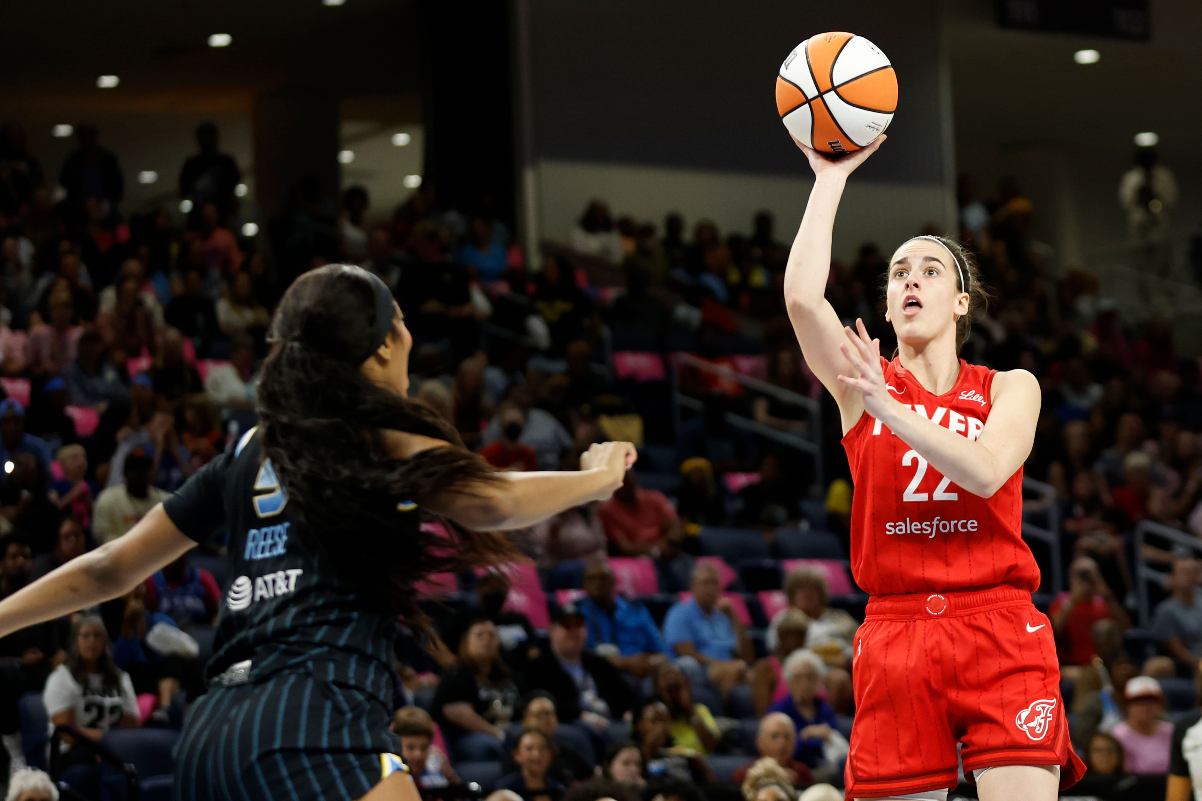 Indiana Fever guard Caitlin Clark shoots against Chicago Sky forward Angel Reese at Wintrust Arena. Photo Credit: Imagn