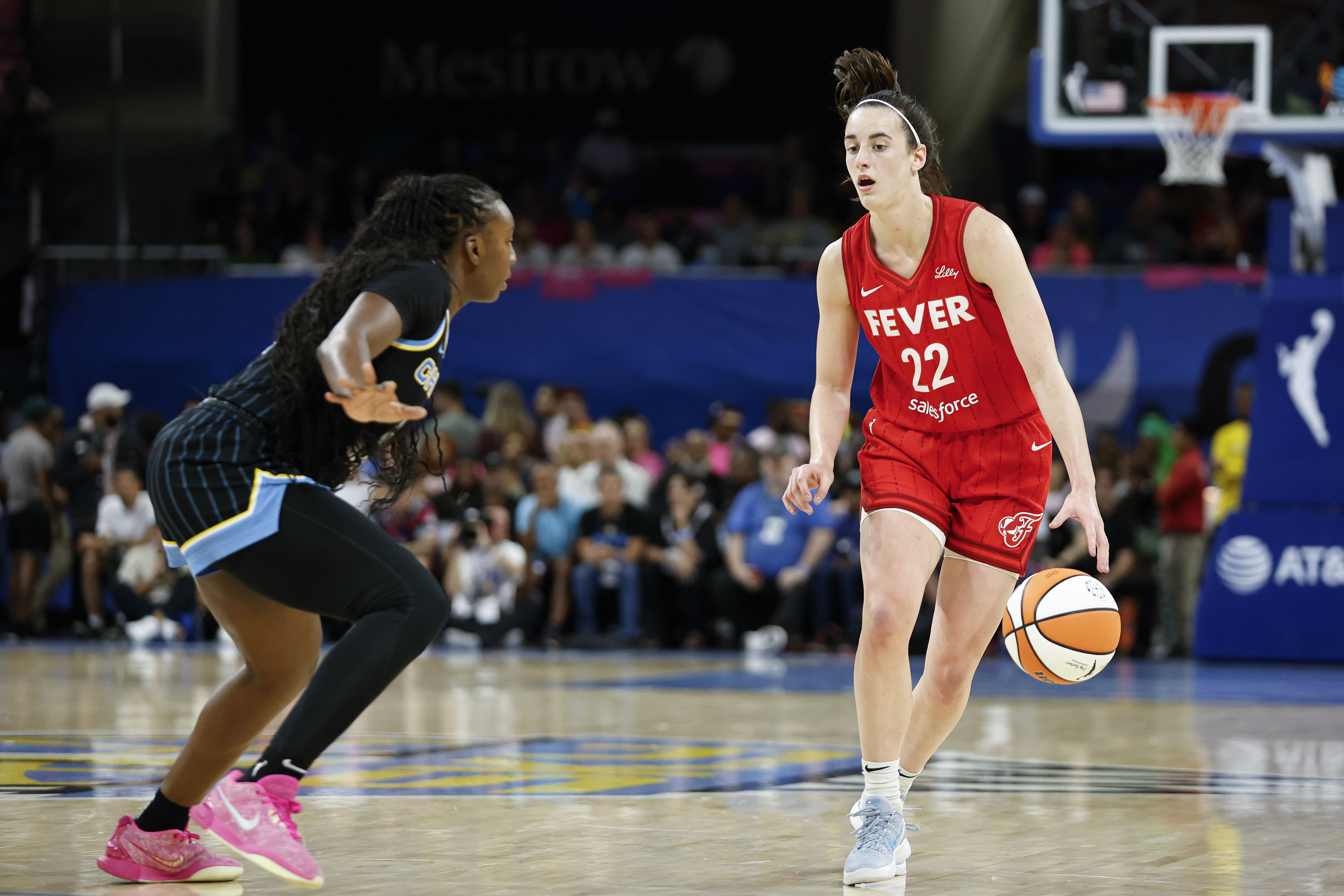 Indiana Fever guard Caitlin Clark brings the ball up court against the Chicago Sky at Wintrust Arena. Photo Credit: Imagn