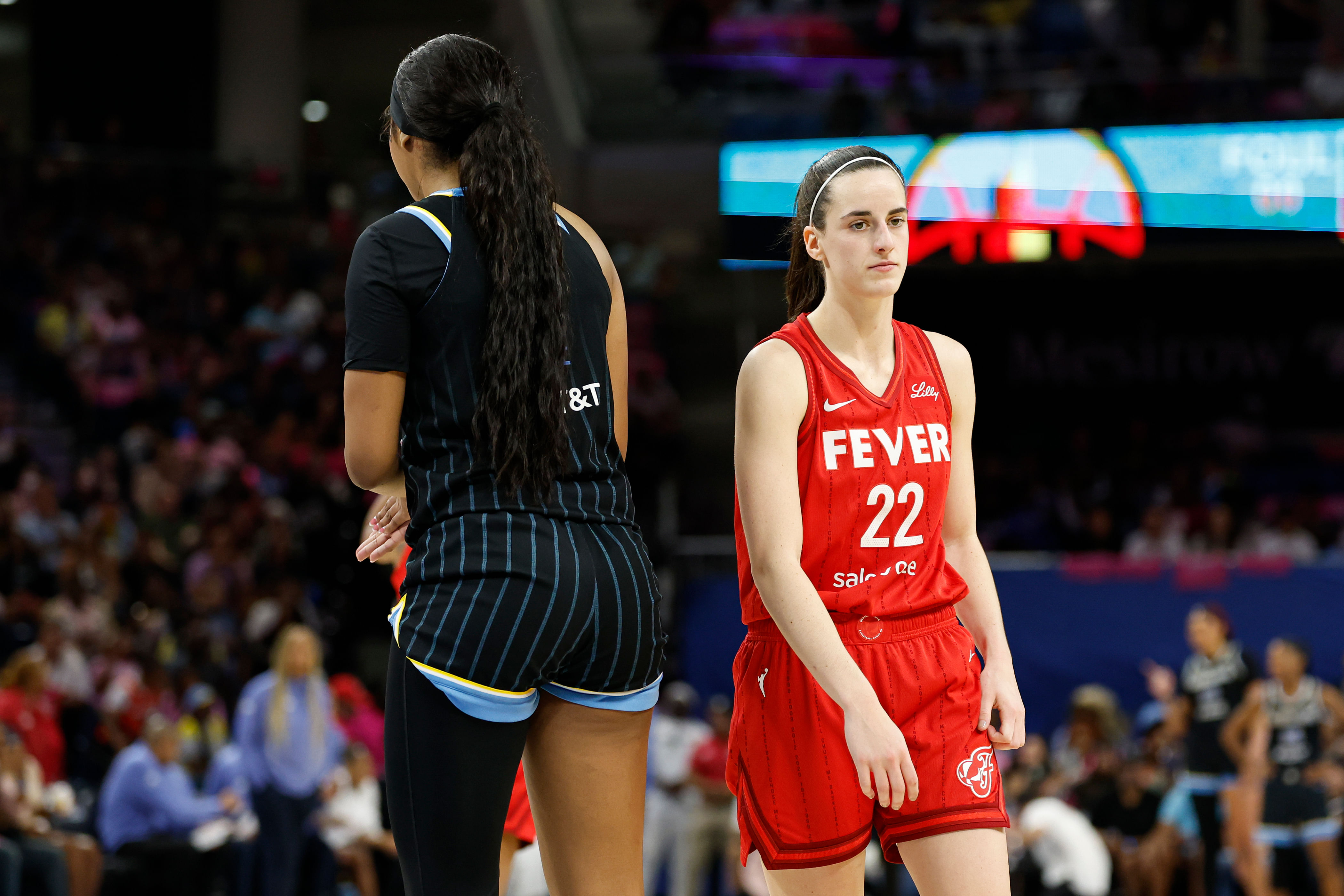 Indiana Fever guard Caitlin Clark walks by Chicago Sky forward Angel Reese during the second half at Wintrust Arena. Photo Credit: Imagn