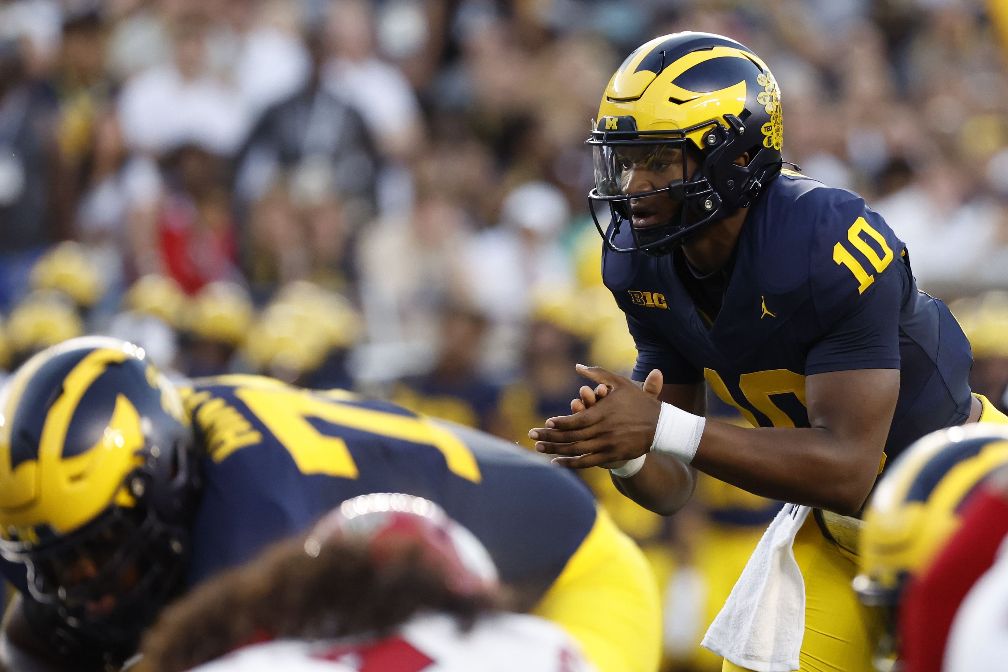 Michigan QB Alex Orji showed his dual-threat skills in high school in Texas. (Photo Credit: IMAGN)