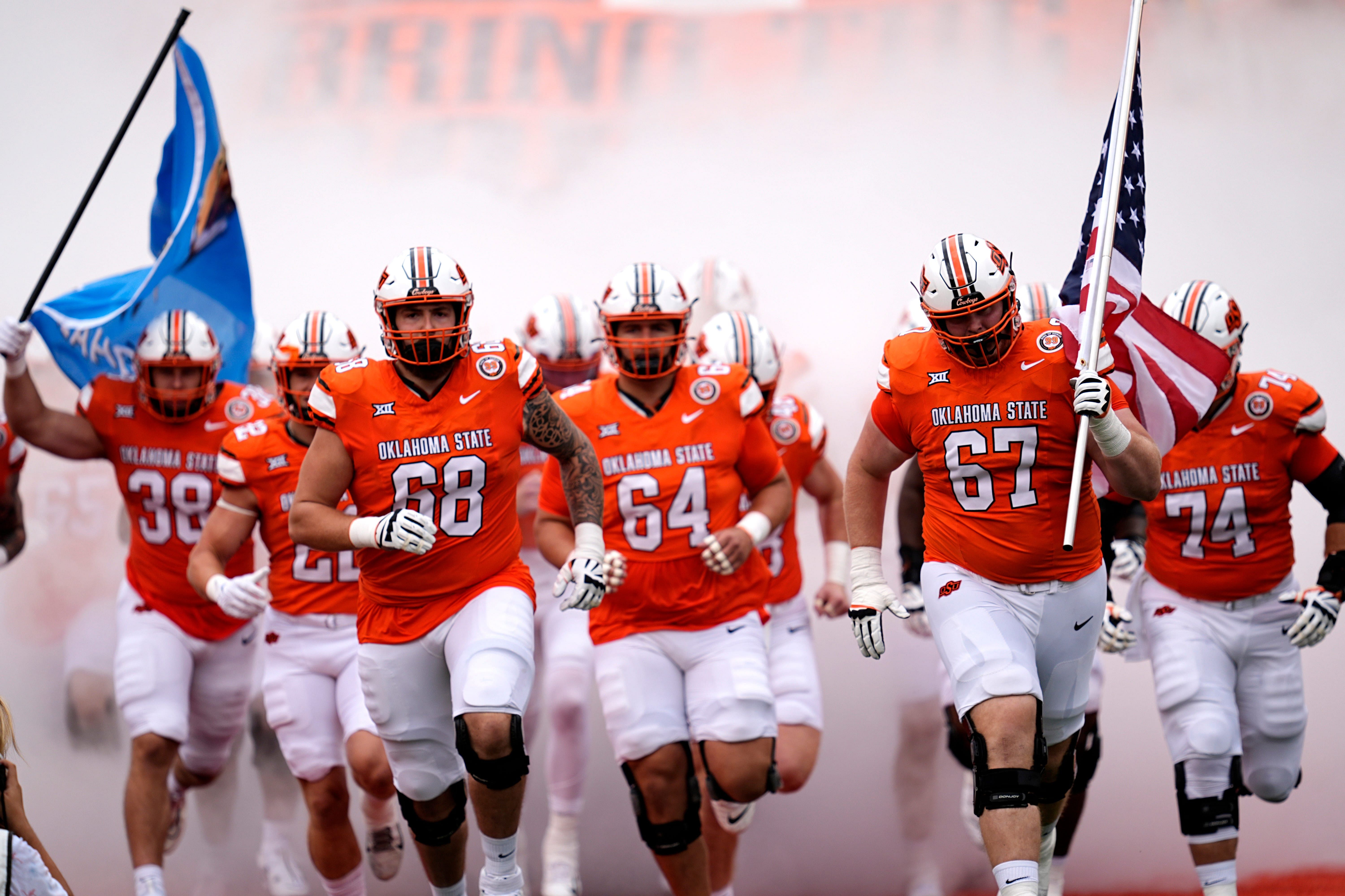 Oklahoma State runs on to the field. Source: Imagn