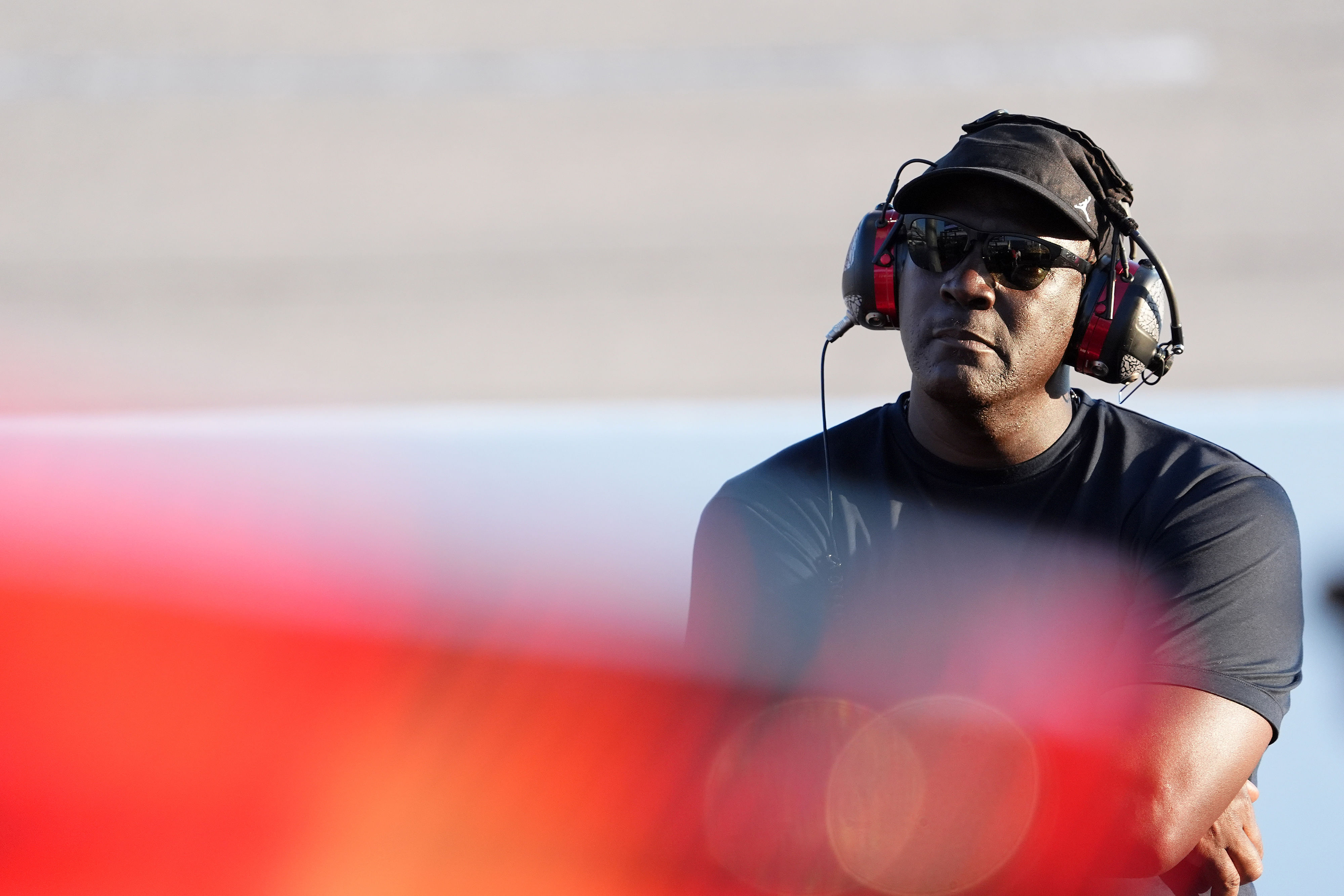 NASCAR Cup Series Team 23XI owner Michael Jordan watches a video board during the Cook Out Southern 500 at Darlington Raceway. Photo Credit: Imagn