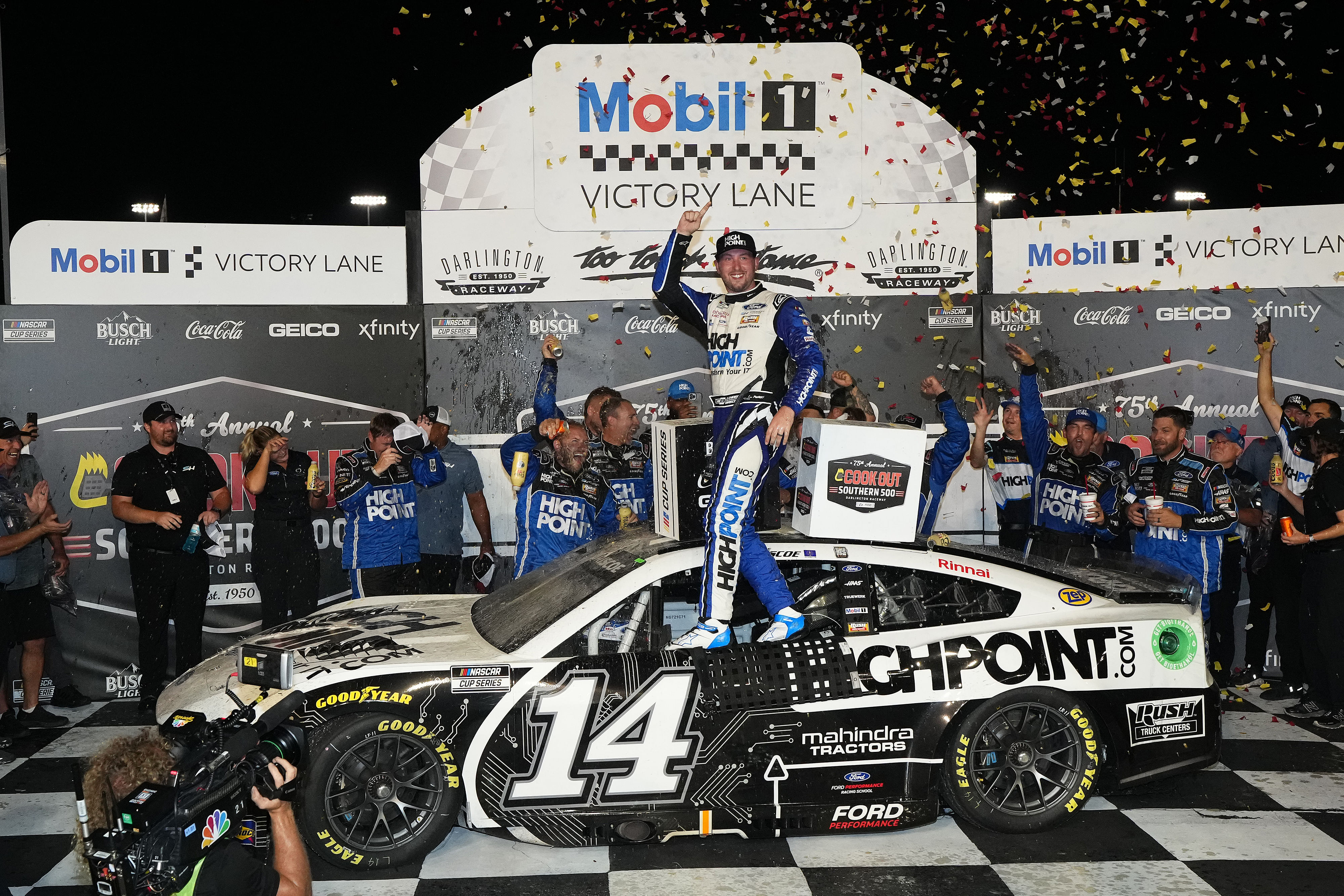 Chase Briscoe (14) celebrates after winning the Cook Out Southern 500 at Darlington Raceway. Mandatory Credit: Jasen Vinlove-Imagn Images