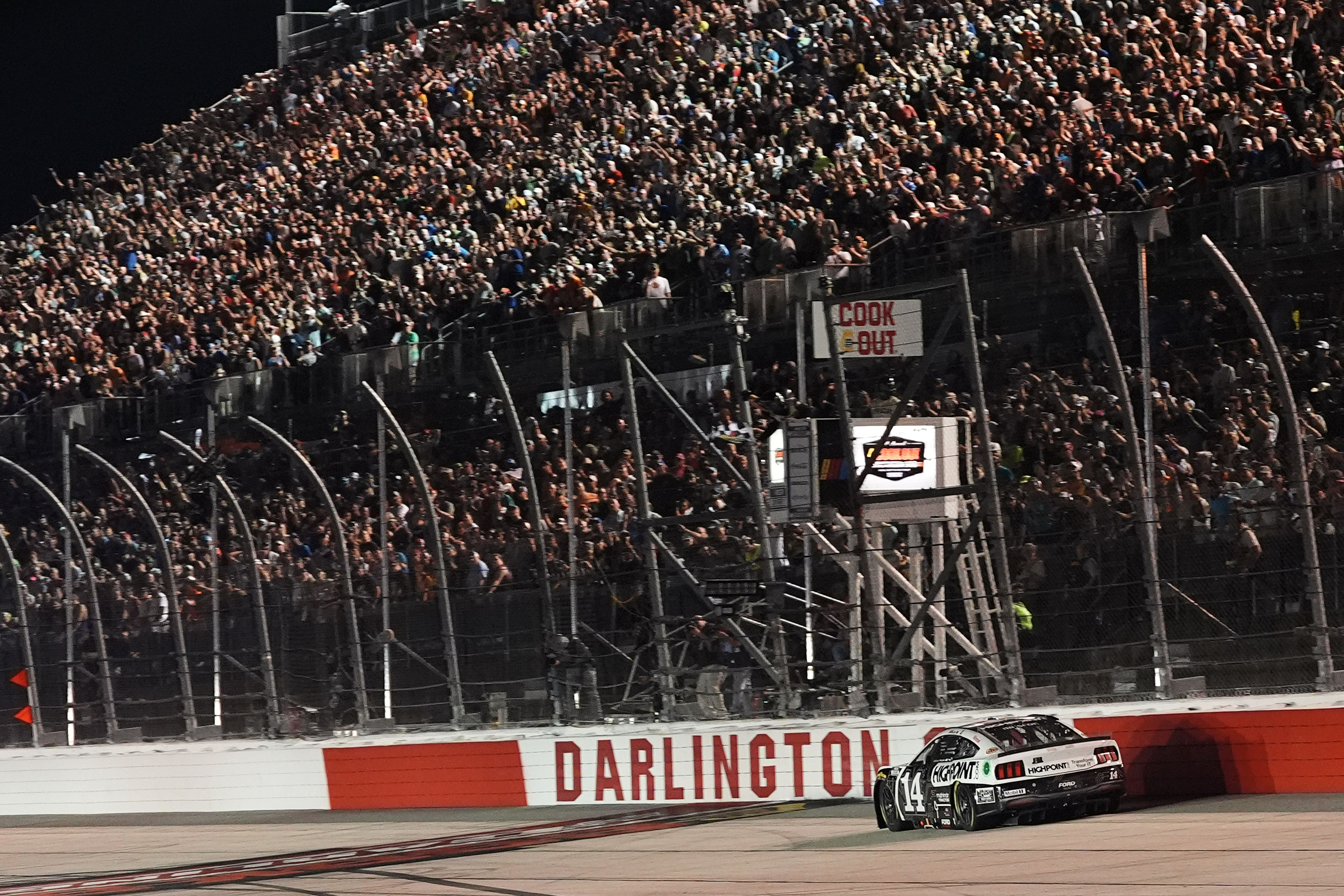 NASCAR Cup Series driver Chase Briscoe (14) crosses the start/finish line to win the Cook Out Southern 500 at Darlington Raceway (Source: Imagn)