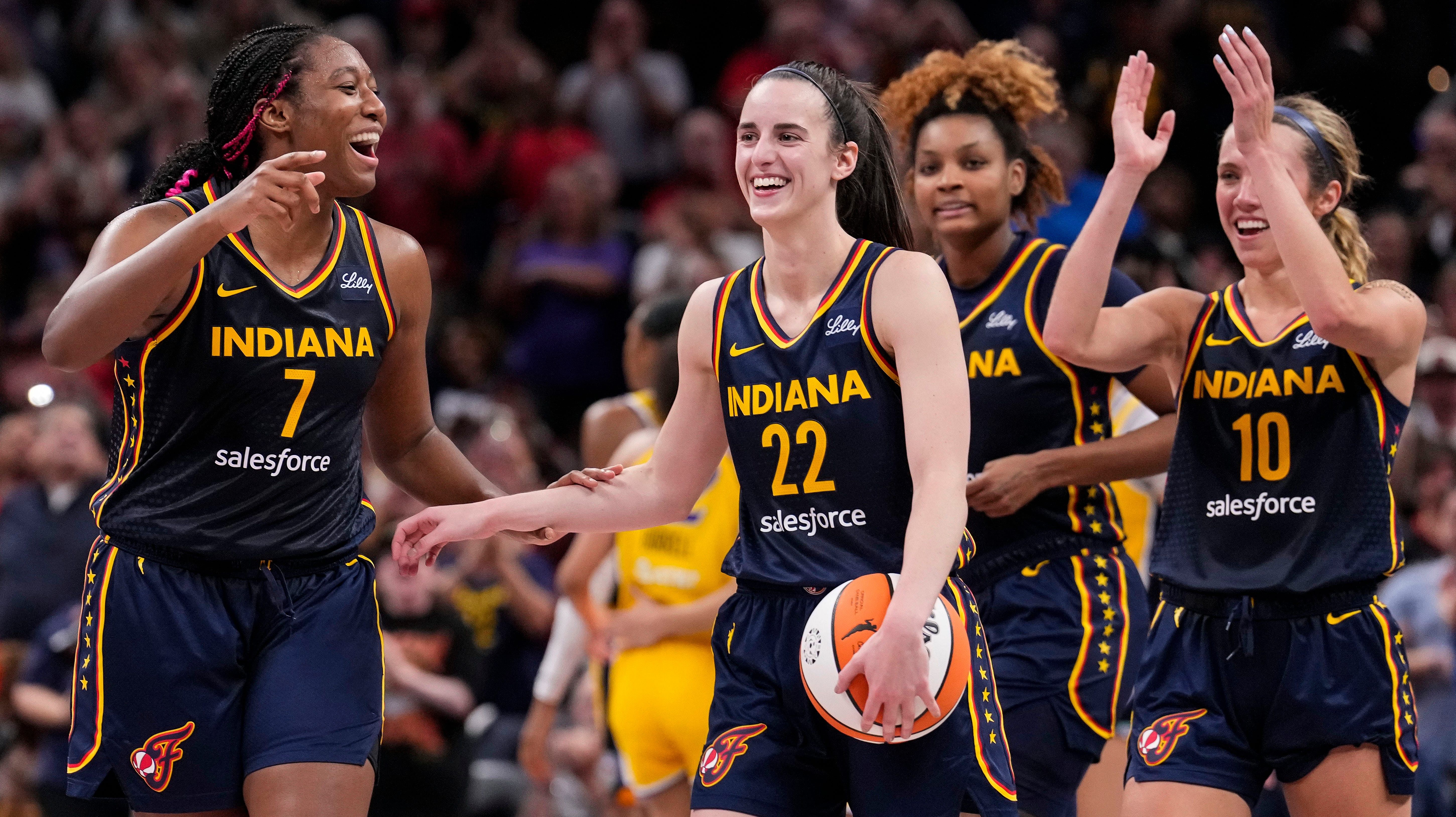 Indiana Fever rookie Caitlin Clark with teammates - Source: Imagn