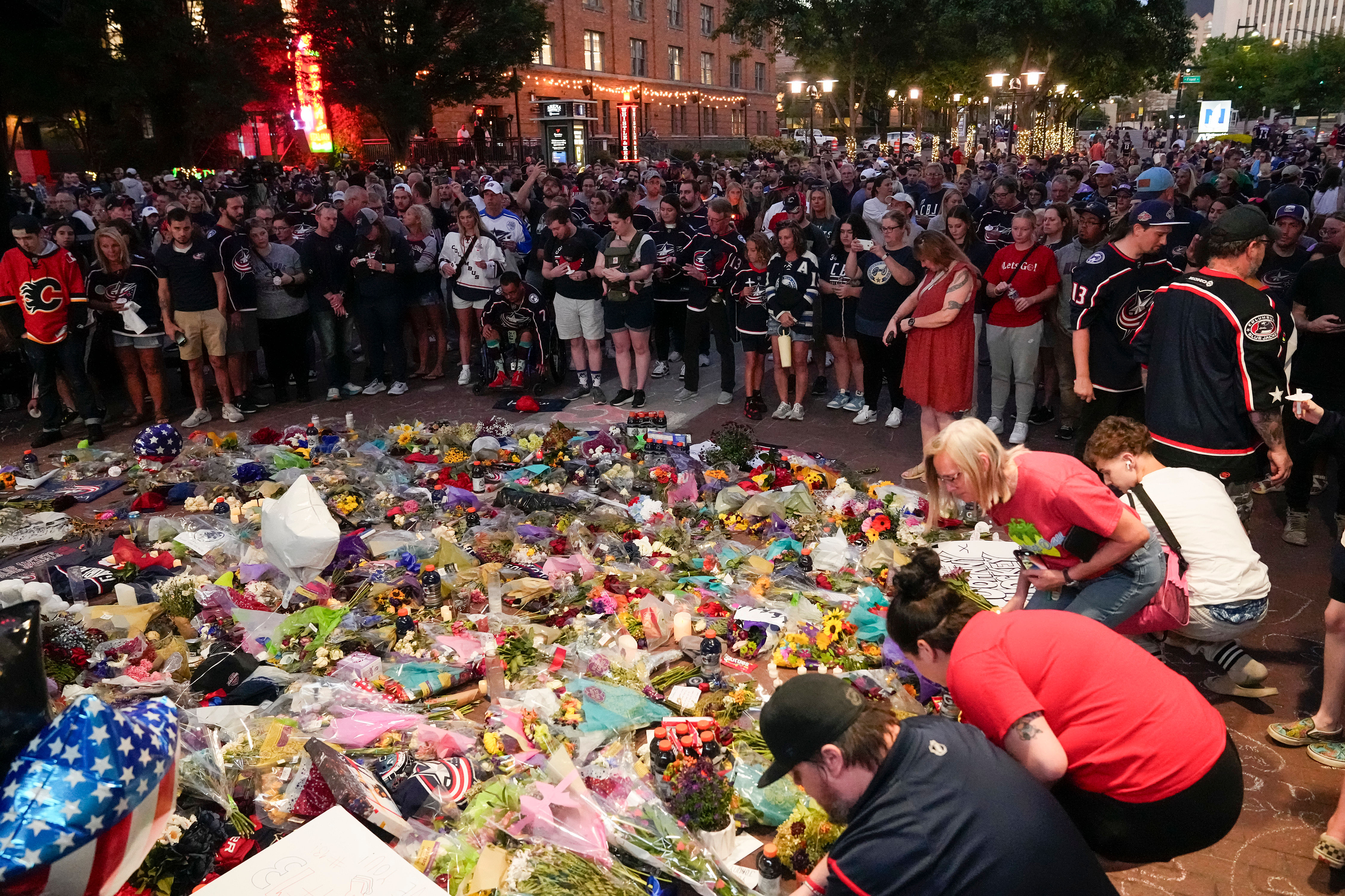 Fans honor Johnny Gaudreau and his brother Matthew (Imagn)