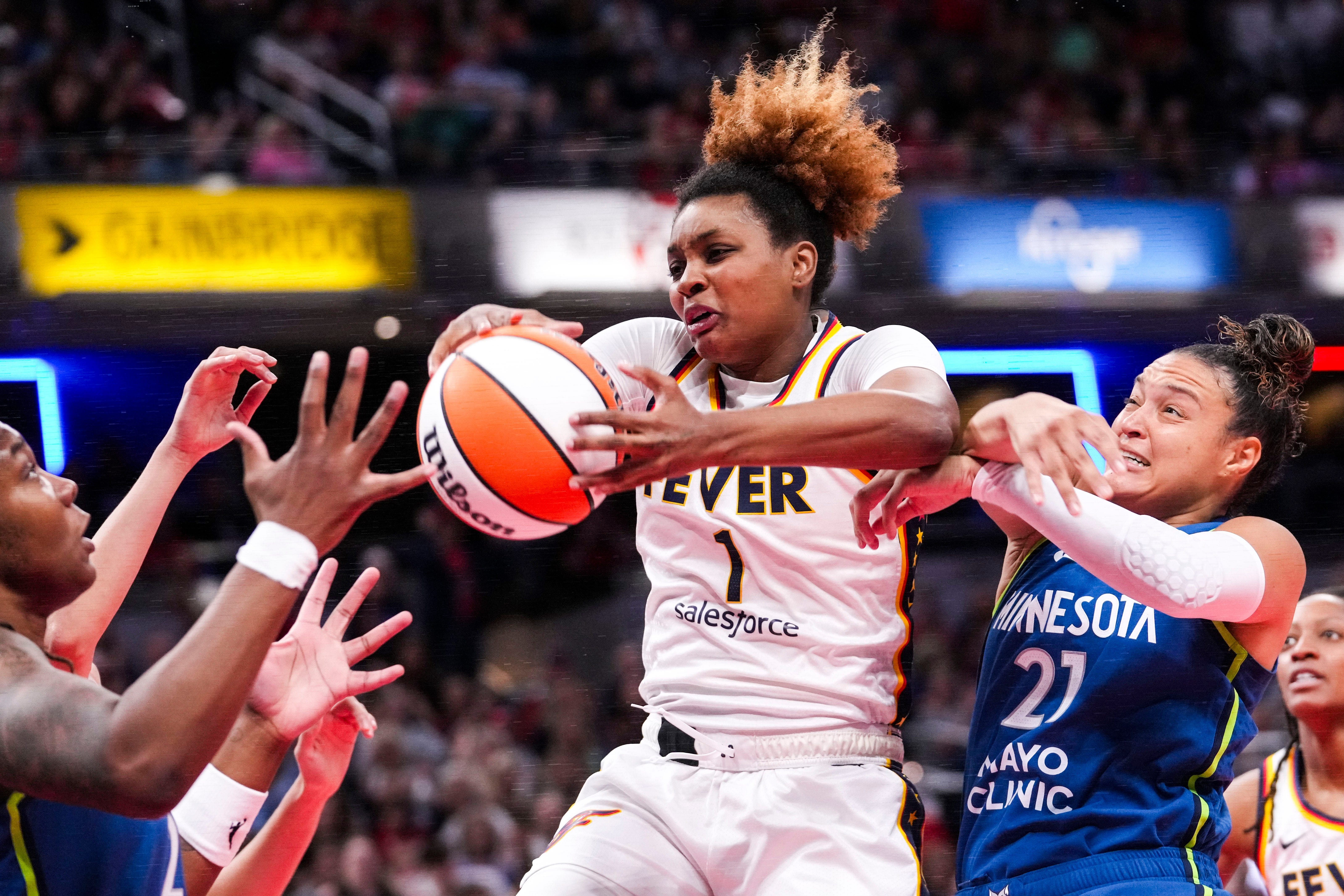 Indiana Fever forward NaLyssa Smith rebounds the ball during a game against the Minnesota Lynx at Gainbride Fieldhouse. Photo Credit: Imagn