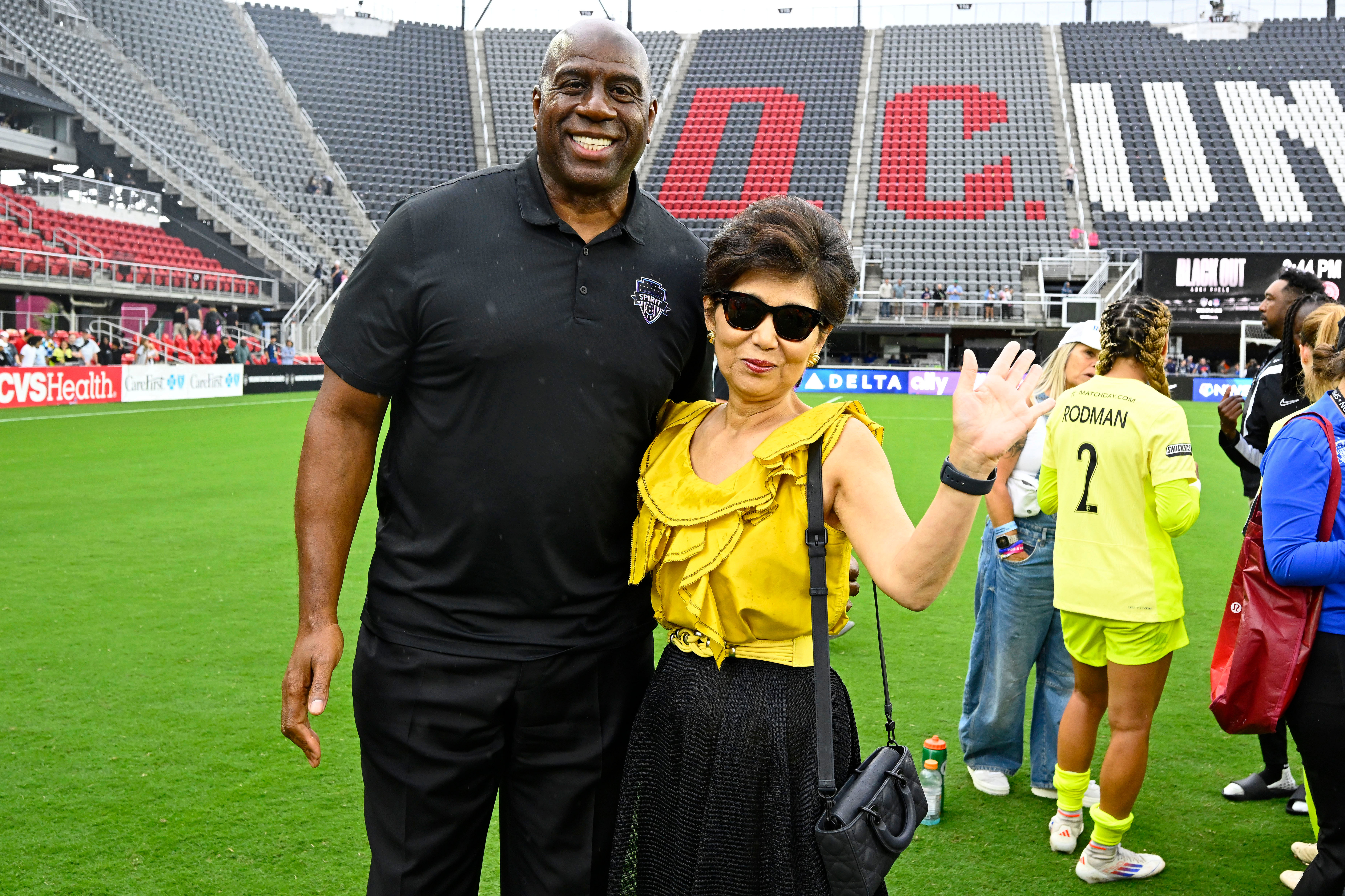 Washington Commanders owner Magic Johnson poses for a photo with Washington Spirit owner Michele Kang after the game against Portland Thorns FC at Audi Field. Photo Credit: Imagn