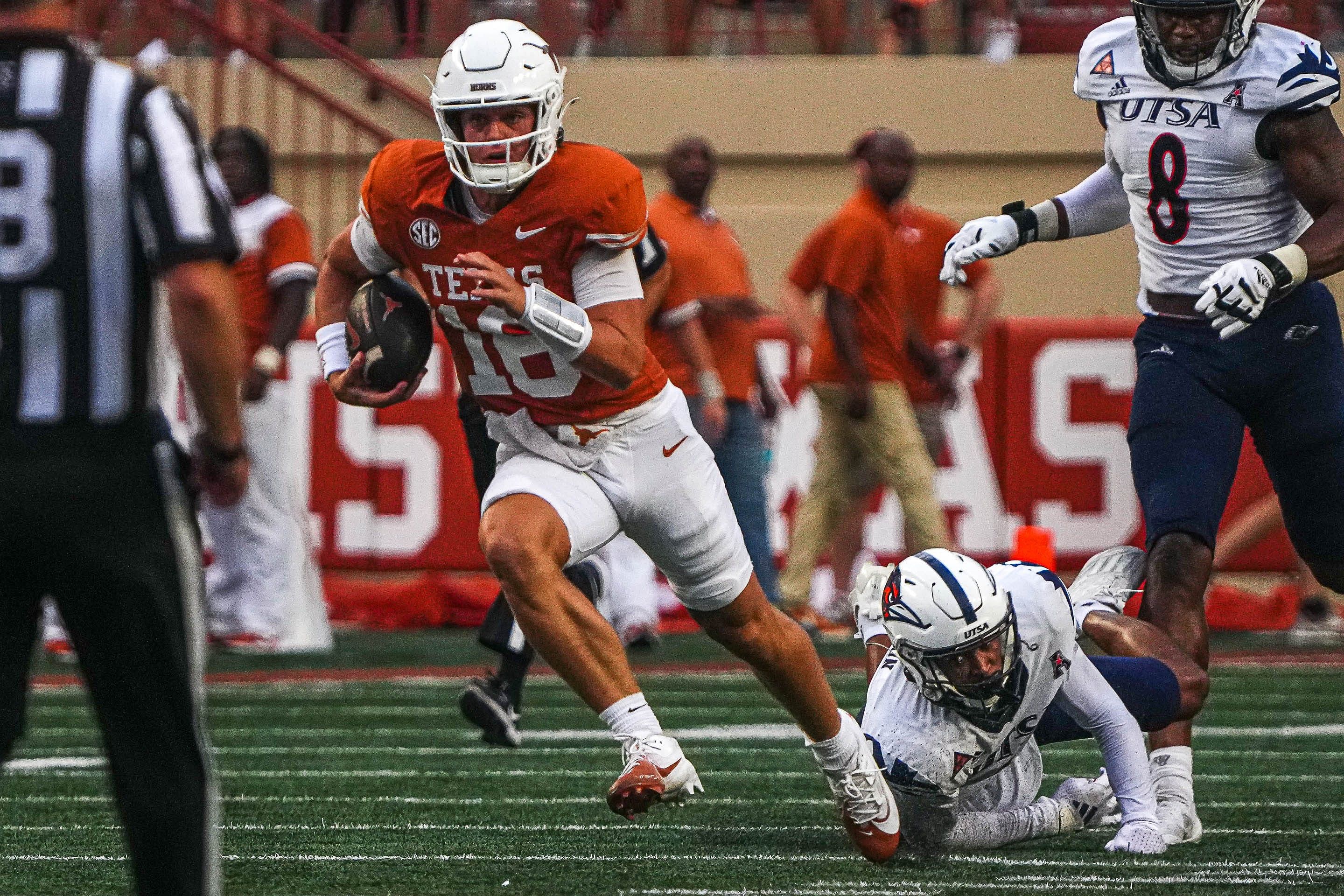 Texas Longhorns quarterback Arch Manning (16) runs the ball during the game against UTSA - Source: Imagn