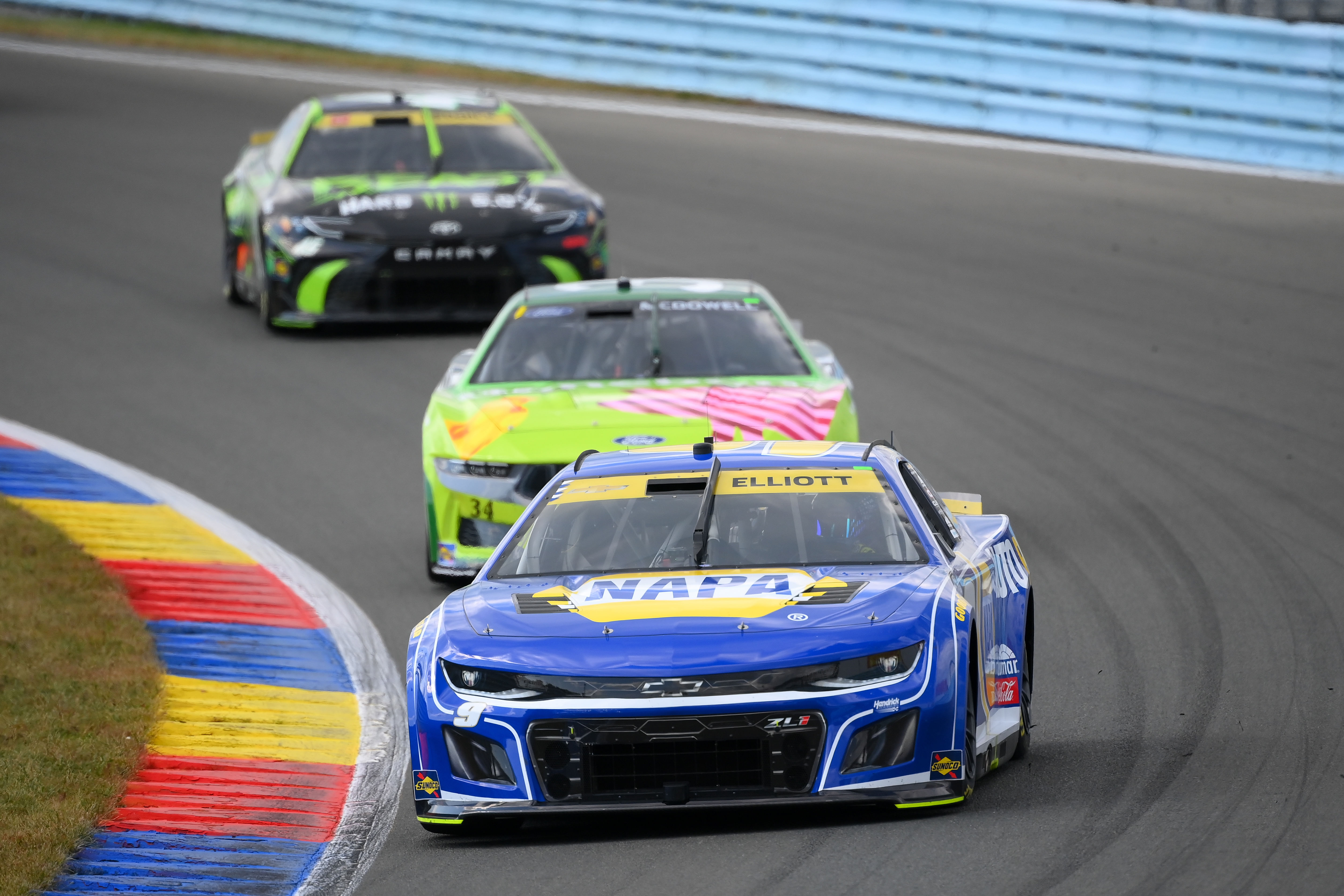 Chase Elliott (9) leads a group of cars during the Go Bowling at The Glen at Watkins Glen International. Mandatory Credit: Rich Barnes-Imagn Images