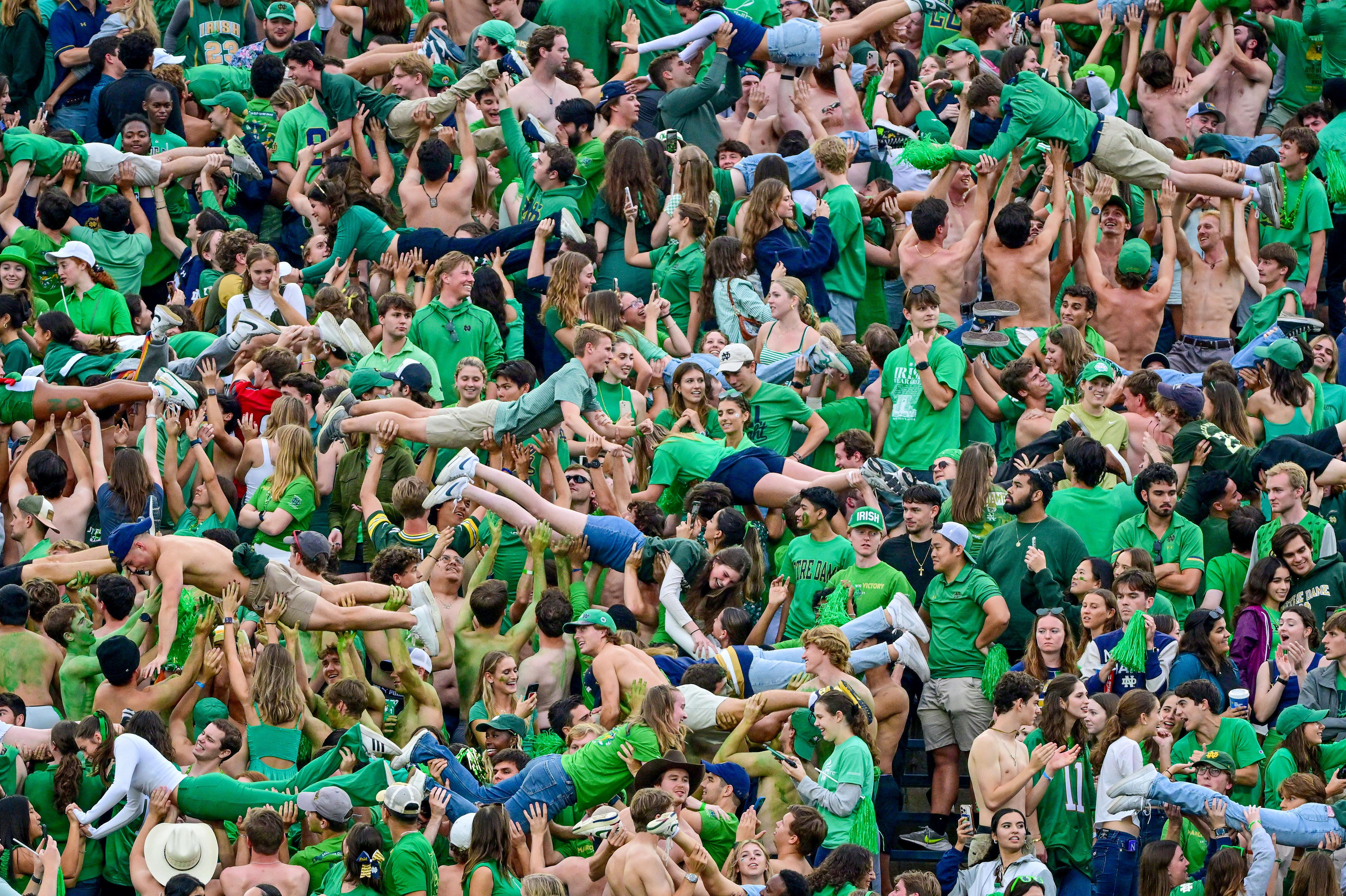 Notre Dame students do pushups in the student section - Source: Imagn