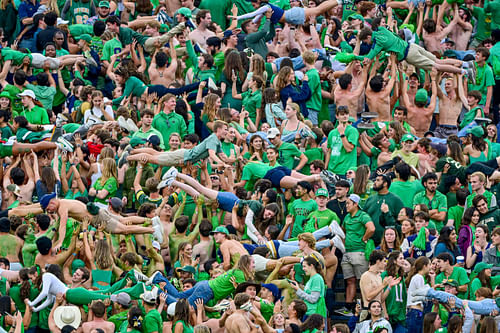 Notre Dame students do pushups in the student section - Source: Imagn