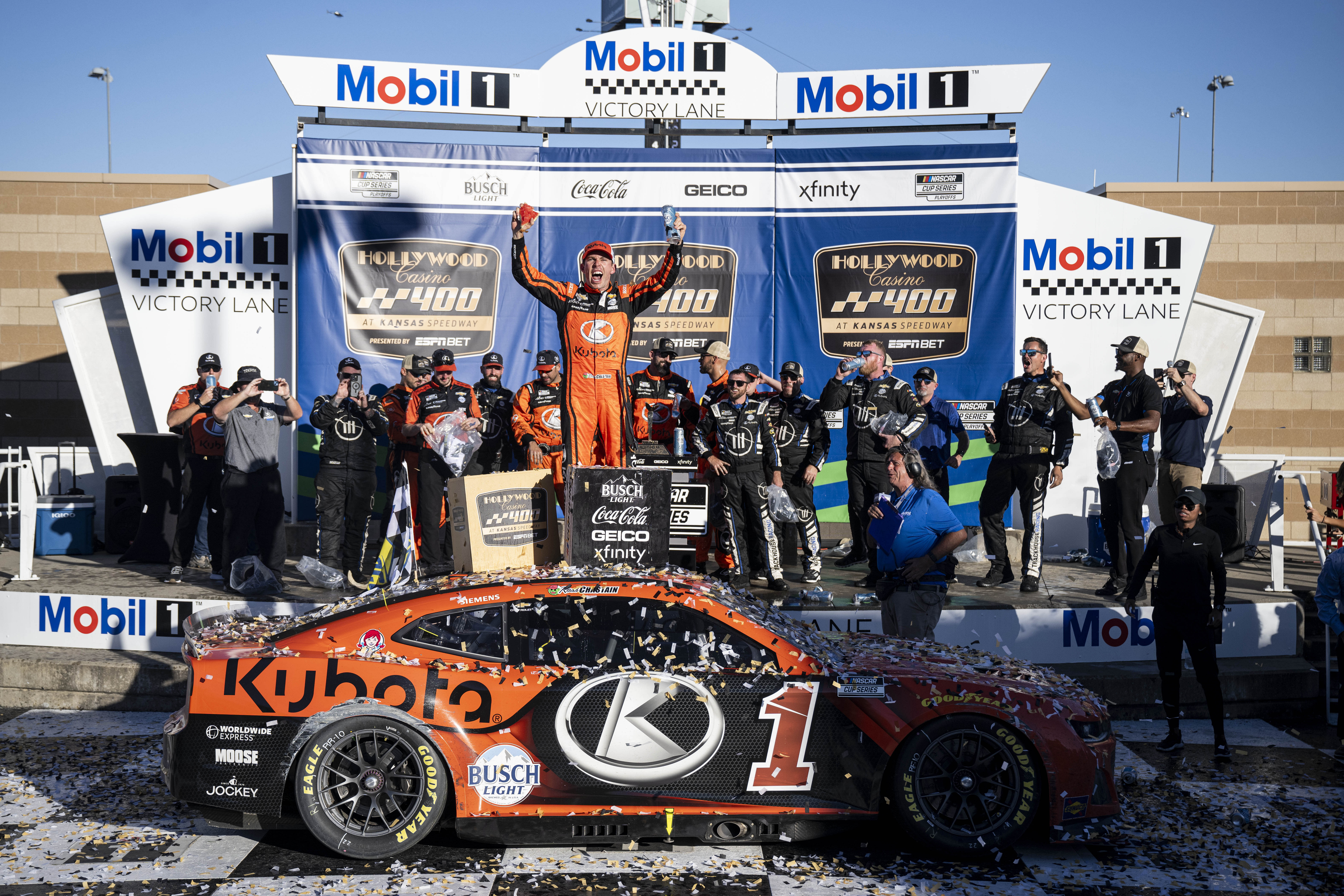 Trackhouse Racing driver Ross Chastain (1) celebrates in Victory Lane after winning the Hollywood Casino 400 [Credit: Imagn]