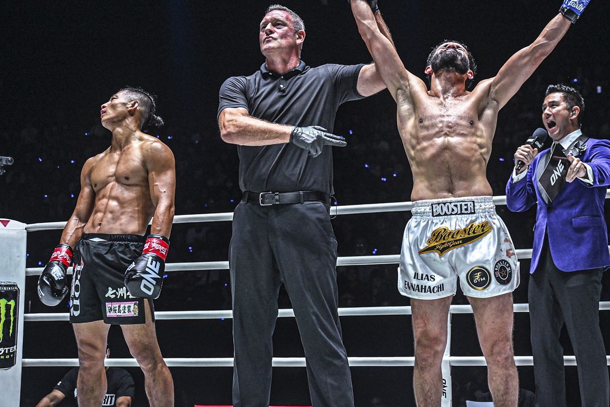 Ilias Ennahachi (right) celebrates his win over Hiroki Akimoto (right). [Photo from ONE Championship]