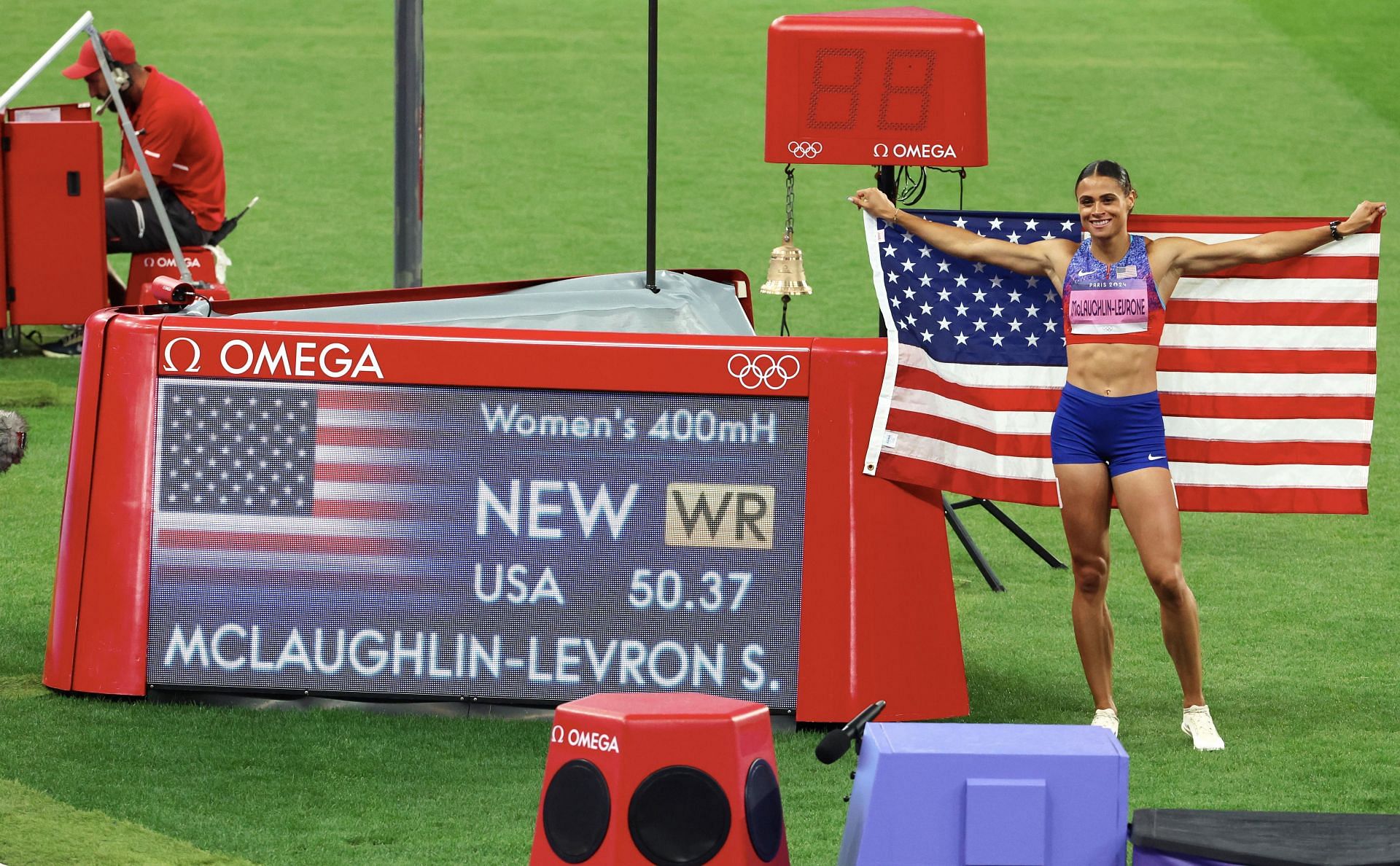 Sydney McLaughlin-Levrone posing with the World Record after winning the 400m hurdles event at the Paris Olympics 2024 [Image Source: Getty]