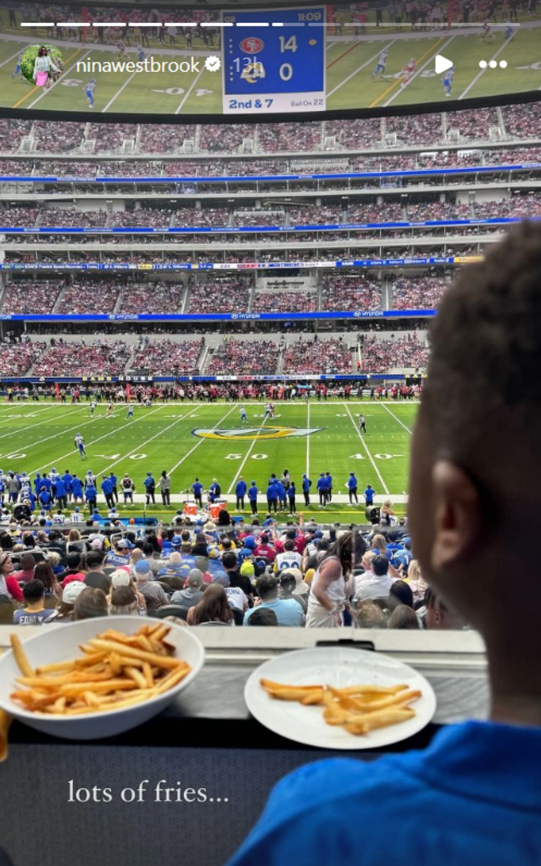 Russell and Nina's son watching the game (Image: @ninawestbrook IG)