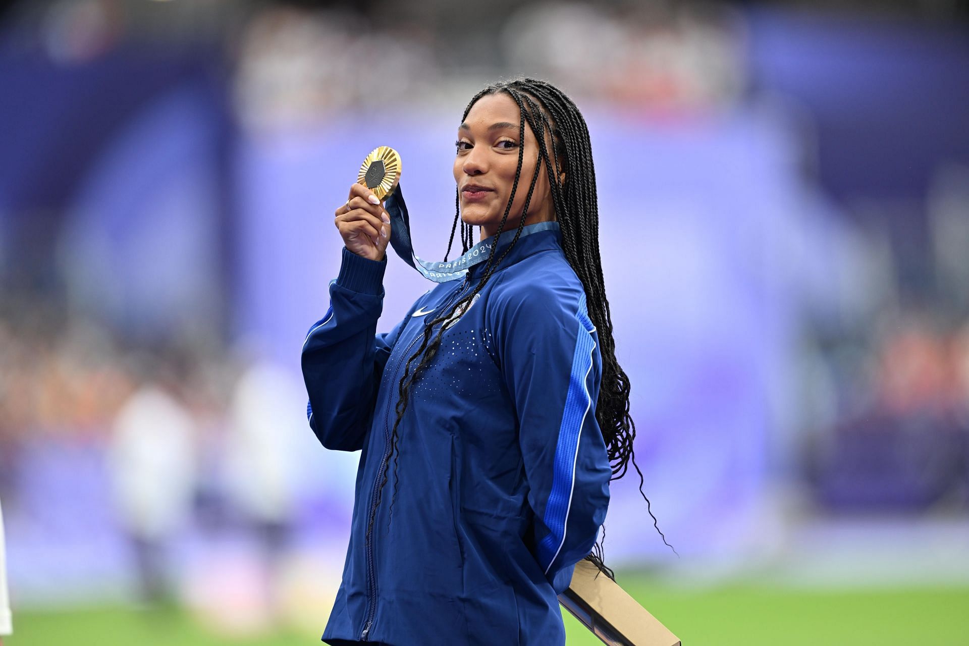 Tara Davis-Woodhall with her gold medal at the Paris Olympics (Image Source: Getty)