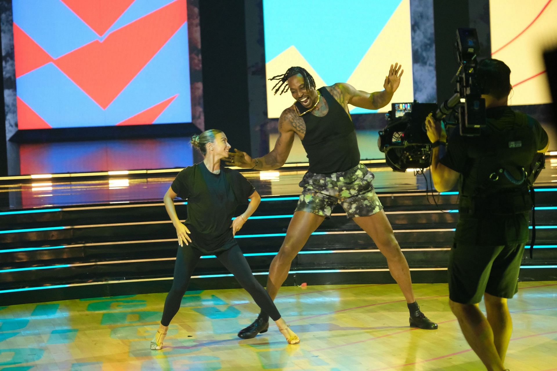 Dwight Howard and Daniella Karagach rehearse for their salsa performance (Photo from Howard