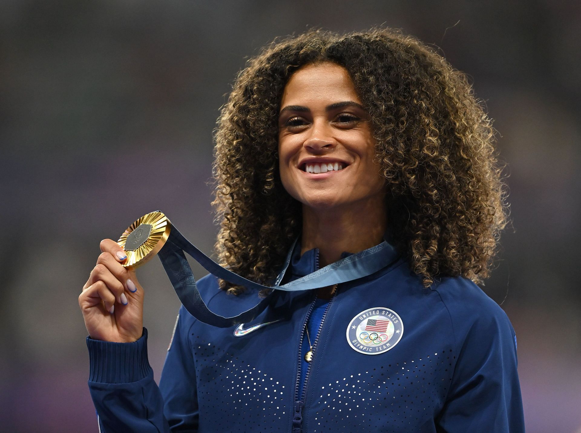 Sydney McLaughlin-Levrone celebrates with her women&#039;s 400m hurdles gold medal during the Summer Olympic Games in Paris, France. (Photo via Getty Images)