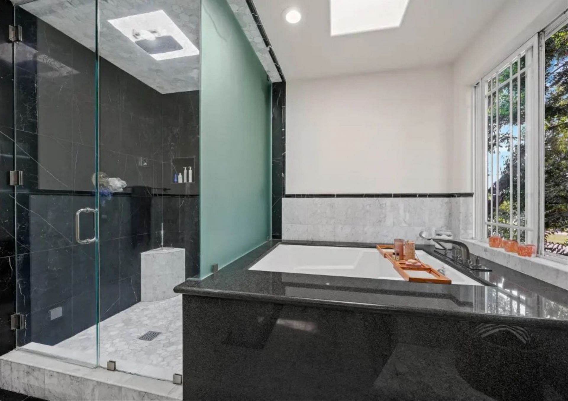 A wide and spacious bathroom can be seen inside