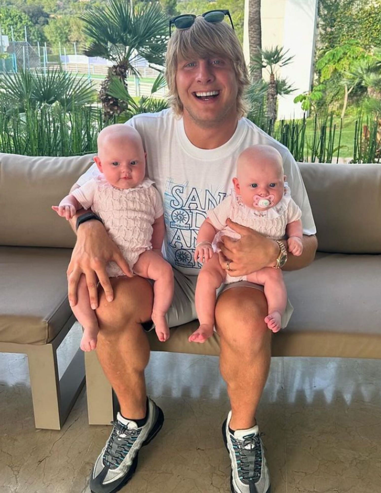 Paddy Pimblett (center) joyfully taking care of his daughters. [via @theufcbaddy on Instagram]