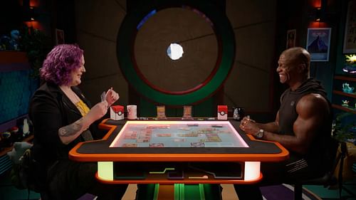 Allison Mattingly and Terry Crews enjoy a match in the trailer for the Pokemon TCG Stellar Crown Showdown (Image via Geek & Sundry/YouTube)