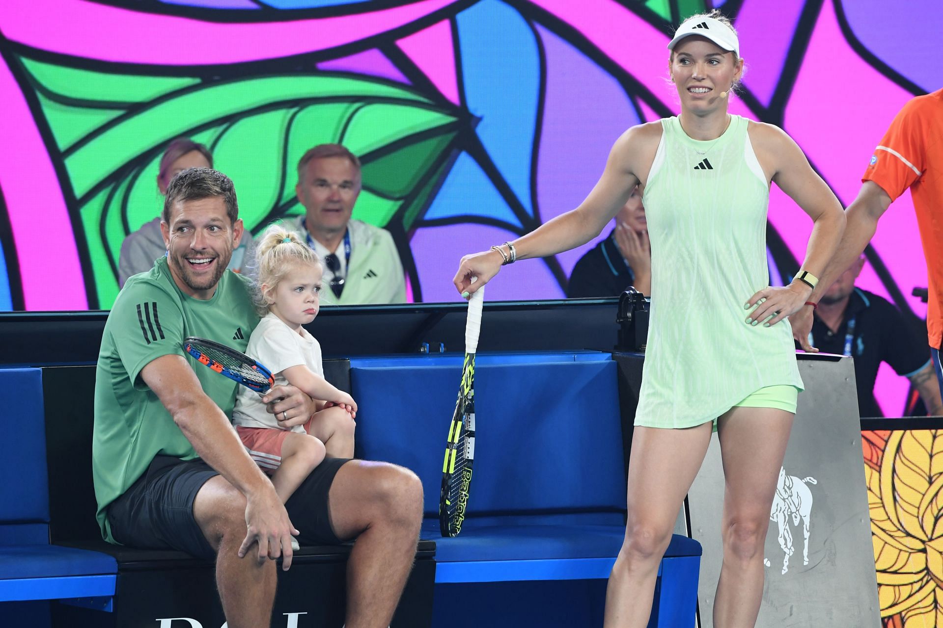 Caroline Wozniacki (R), her husband David Lee (L), and their daughter Olivia at the 2024 Australian Open (Image: Getty)