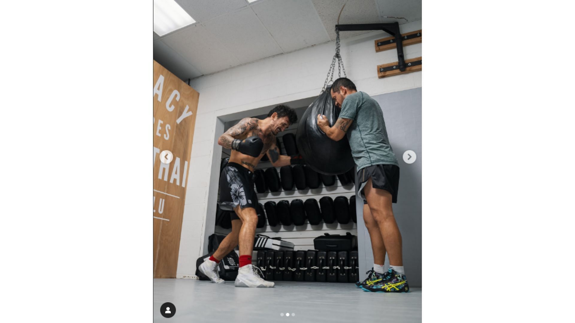 Holloway hitting a punching bag