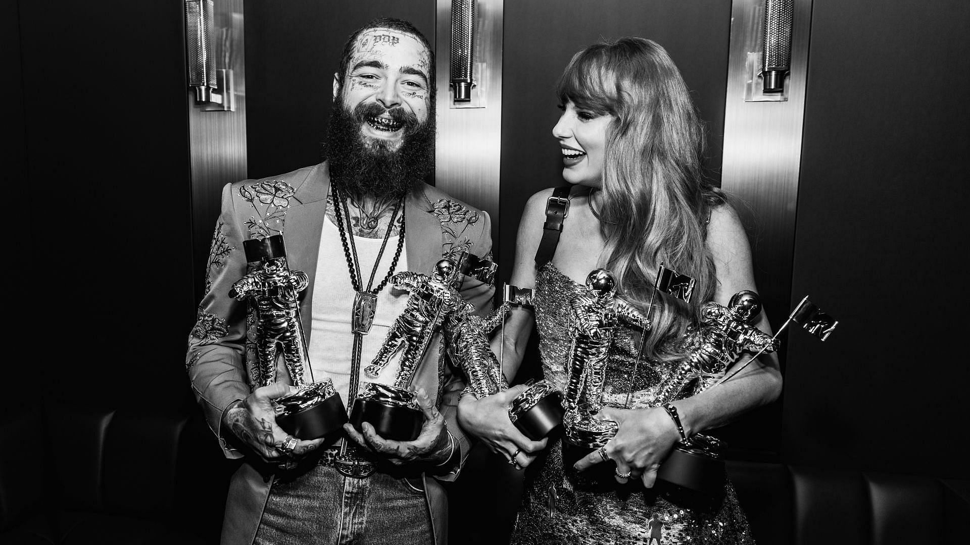 (EDITORS NOTE: Image has been converted to black and white.) (L-R) Post Malone and Taylor Swift are seen backstage at the 2024 MTV Video Music Awards at UBS Arena on September 11, 2024 in Elmont, New York. (Photo by John Shearer/Getty Images for MTV)