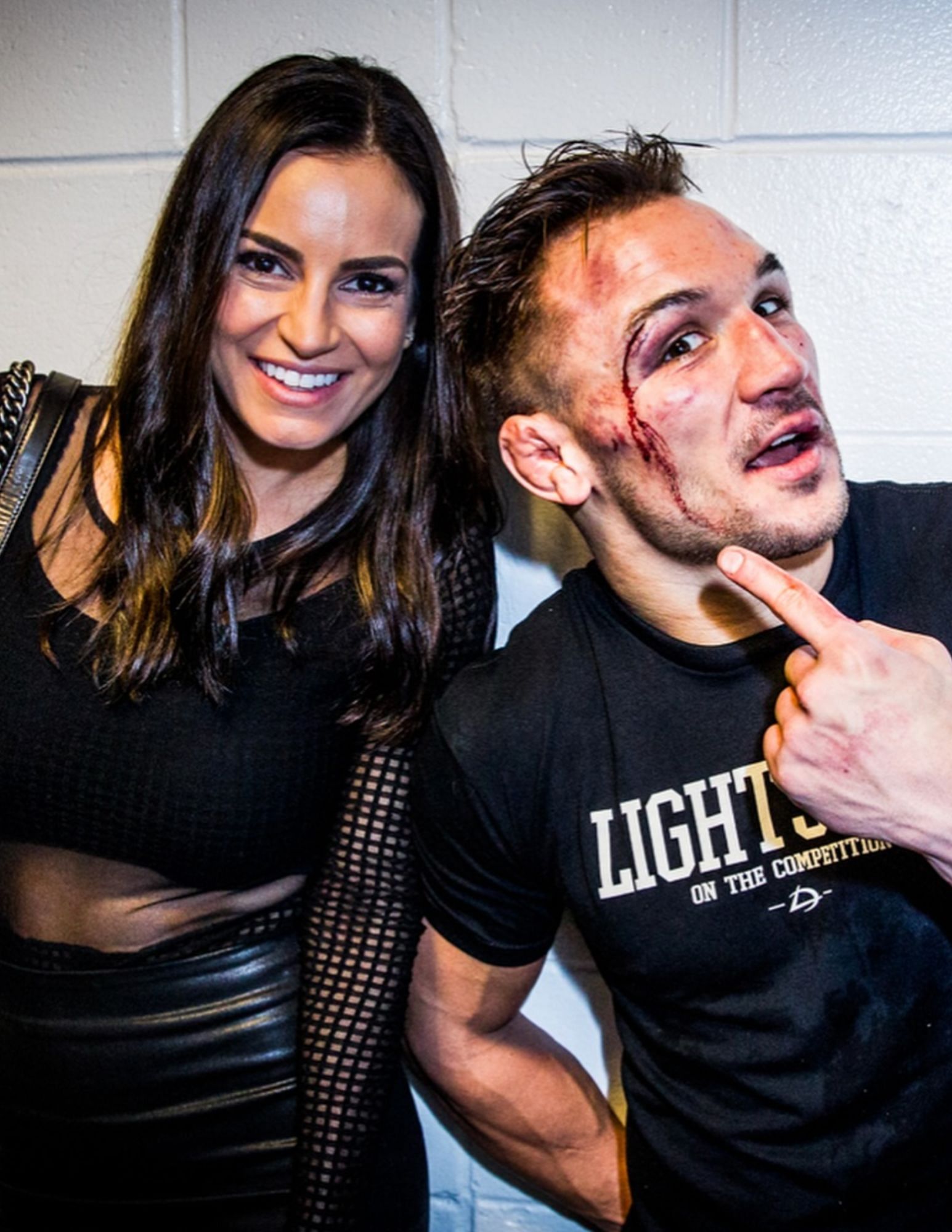 Michael (right) and Brie Chandler (left) after one of the former's fights. [via @mikechandlermma on Instagram]