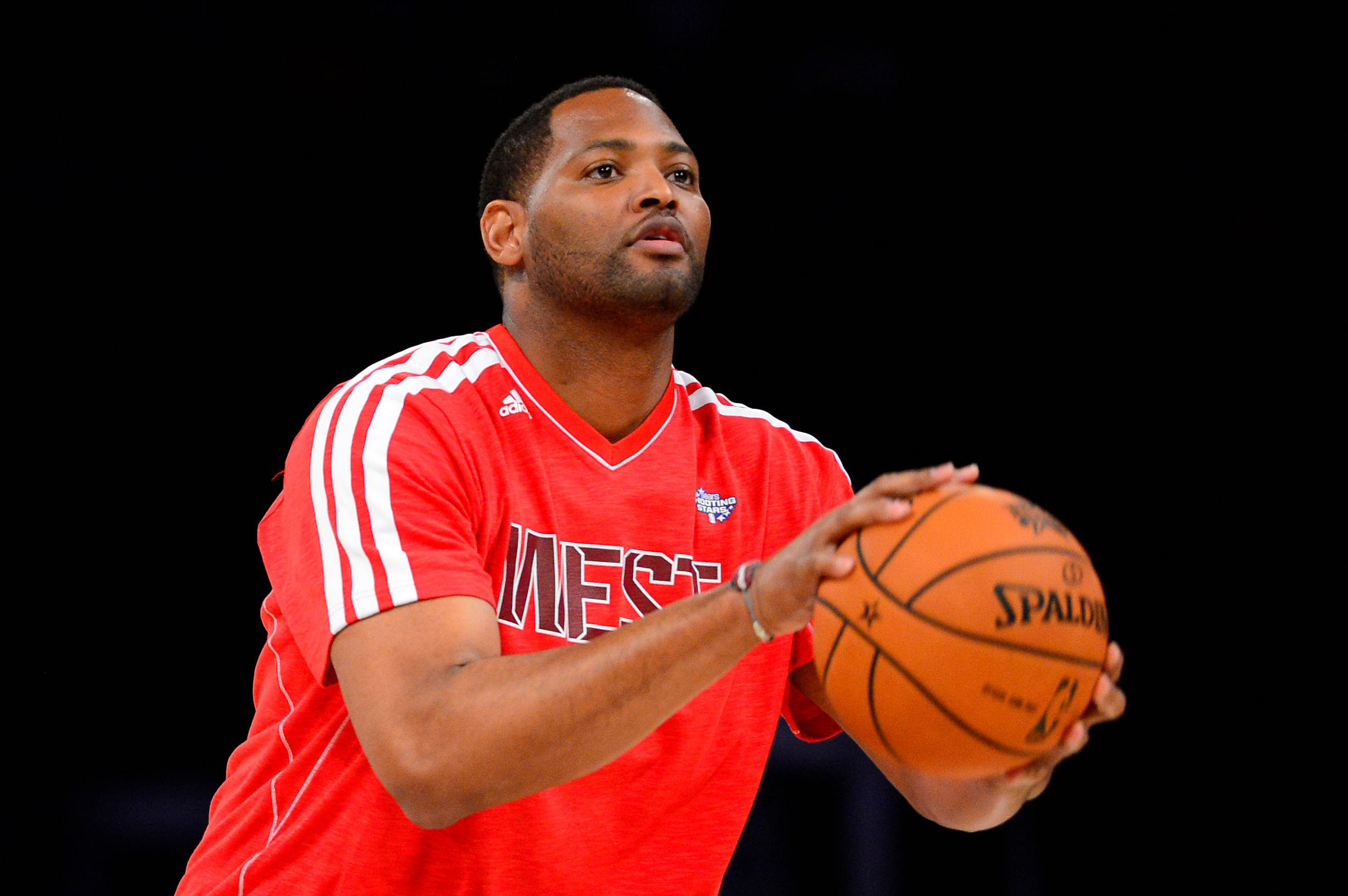 Former NBA player Robert Horry shoots during the 2013 All-Star shooting stars competition at the Toyota Center. Photo Credit: Imagn