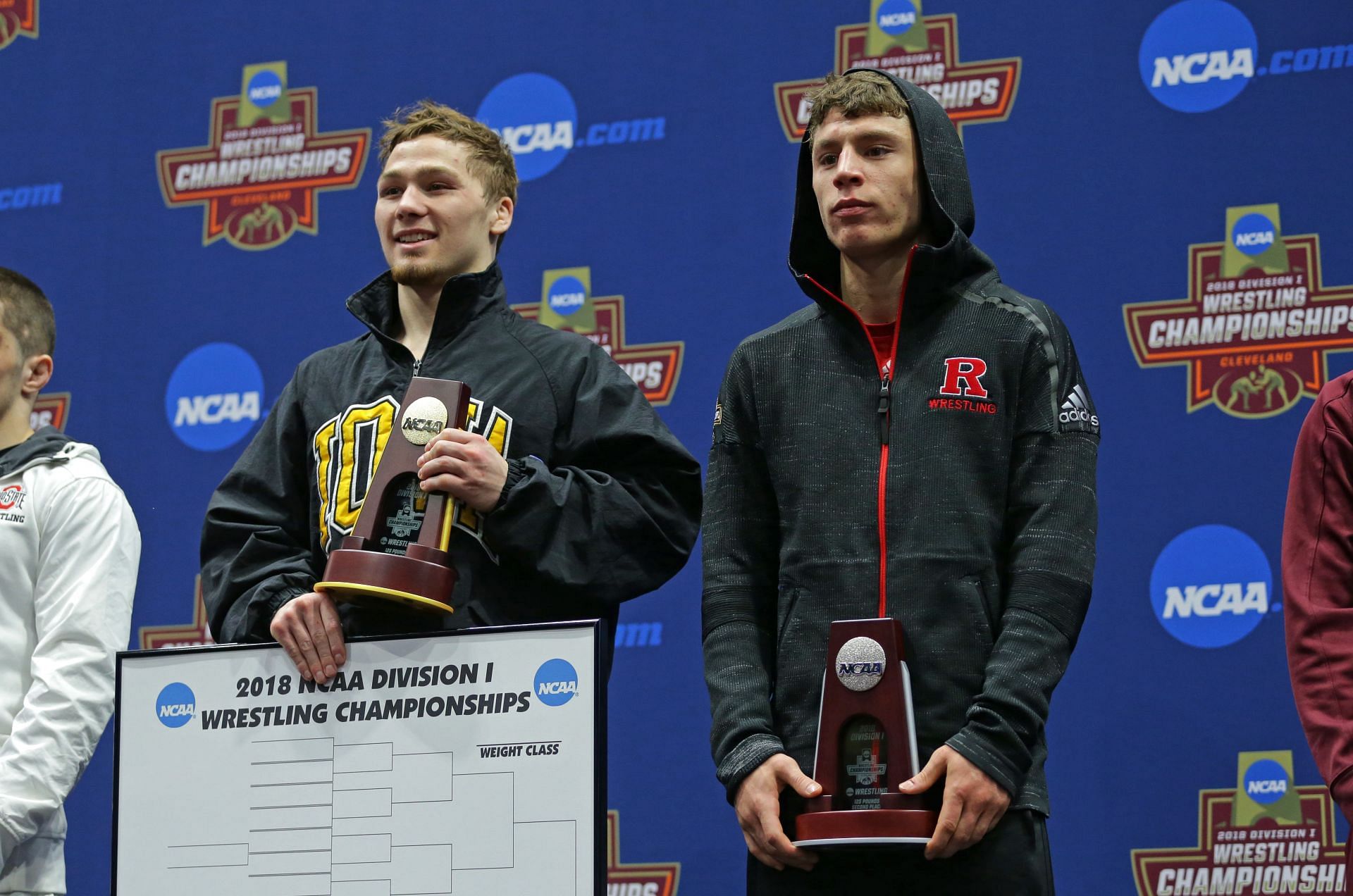 Spencer Lee of the Iowa Hawkeyes on the awards podium at the 2018 NCAA Division I Championships. (Photo by Hunter Martin/Getty Images)