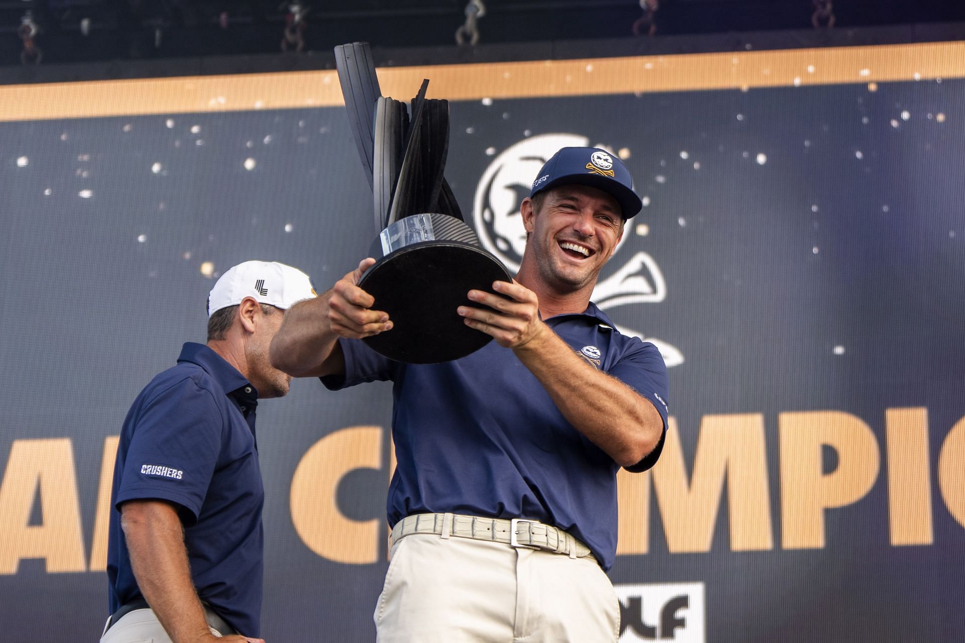 Crushers GC&#039;s captain Bryson DeChambeau celebrates with the team title trophy after winning LIV Golf Chicago at Bolingbrook Golf Club.  (Image Source: Getty)