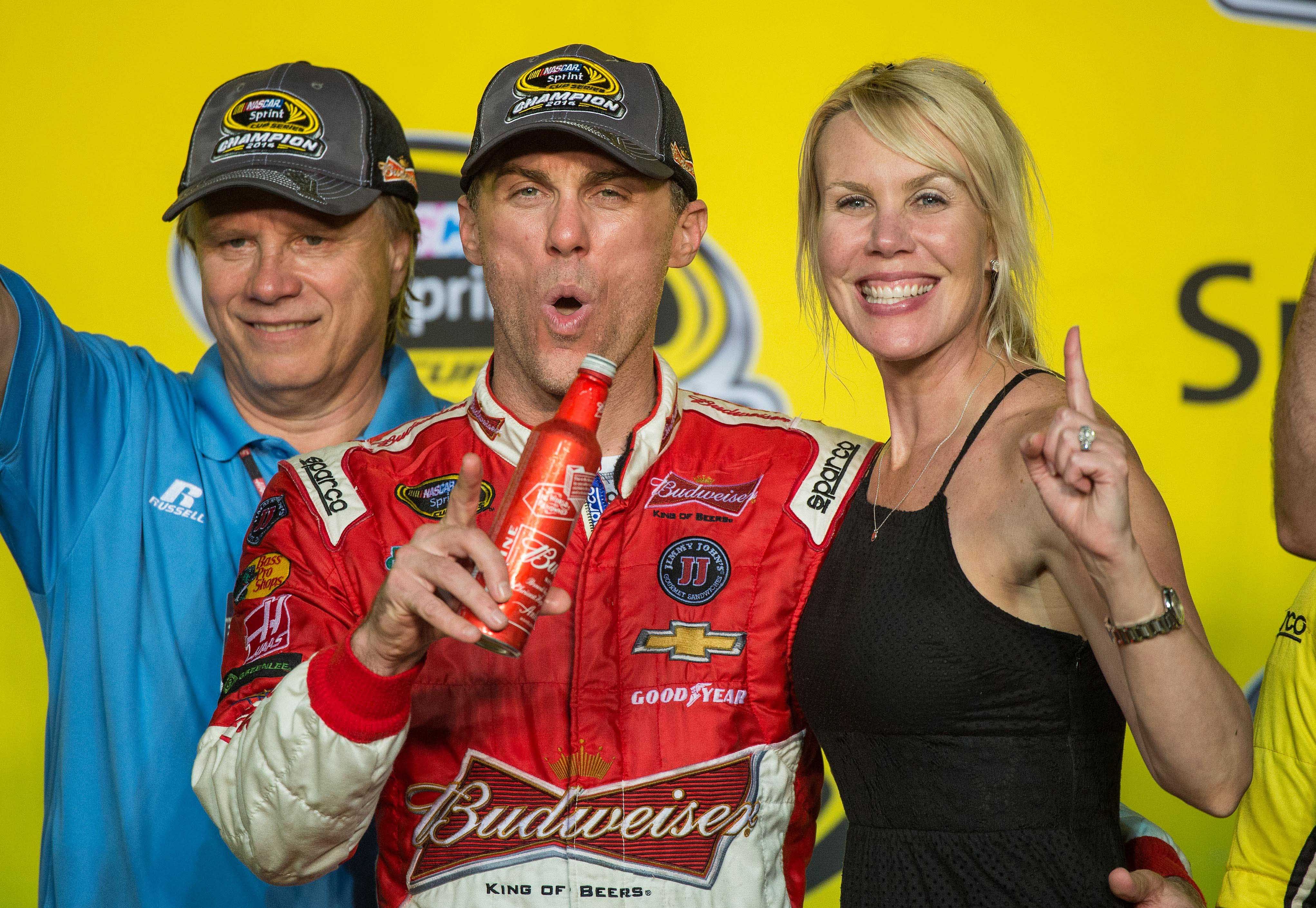 Kevin Harvick (4) and wife DeLana Harvick celebrate Harvick winning the Sprint Cup championship. Mandatory Credit: Jerome Miron-USA TODAY Sport. Source: Imagn