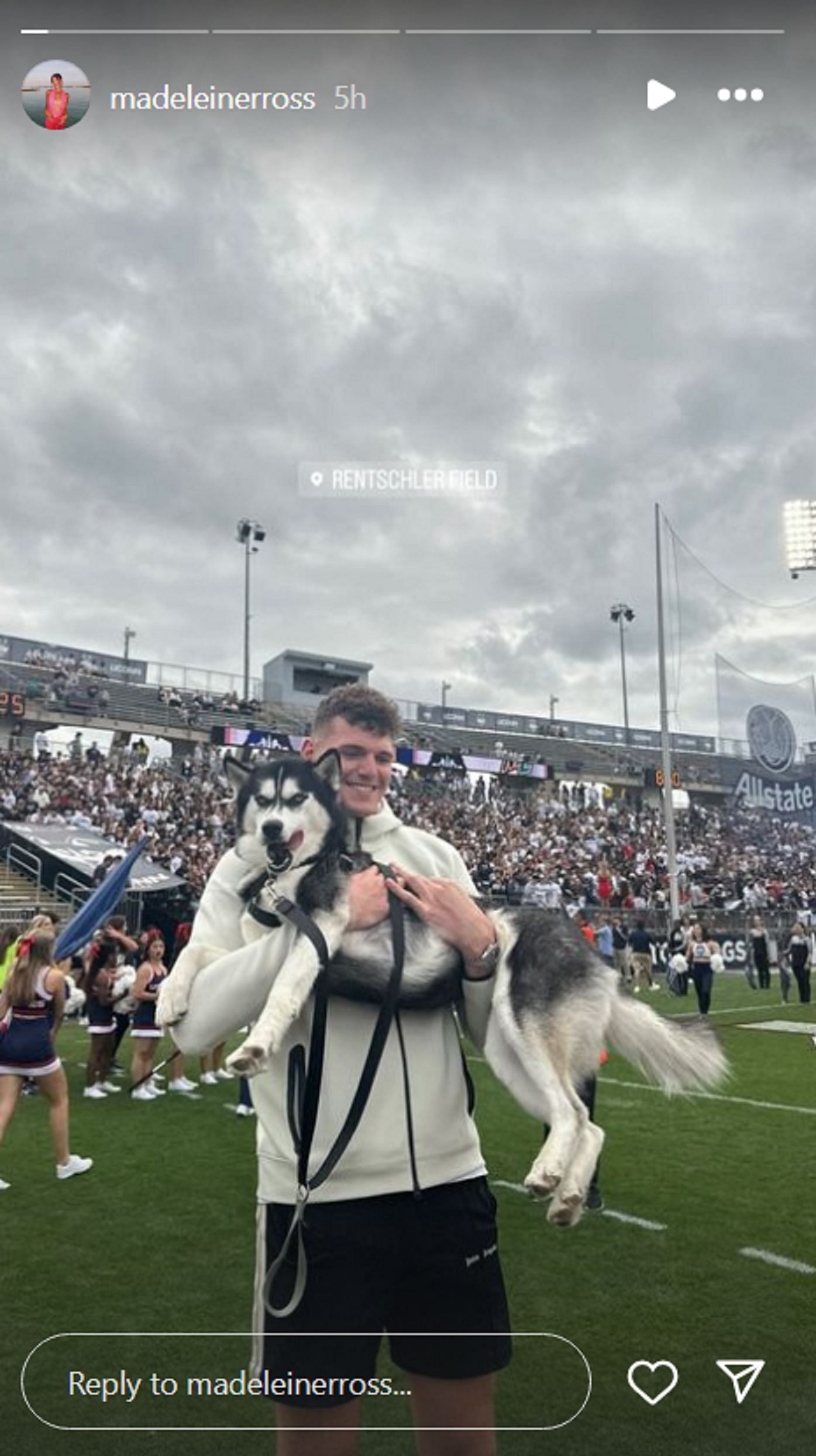 Donovan Clingan holding a Husky